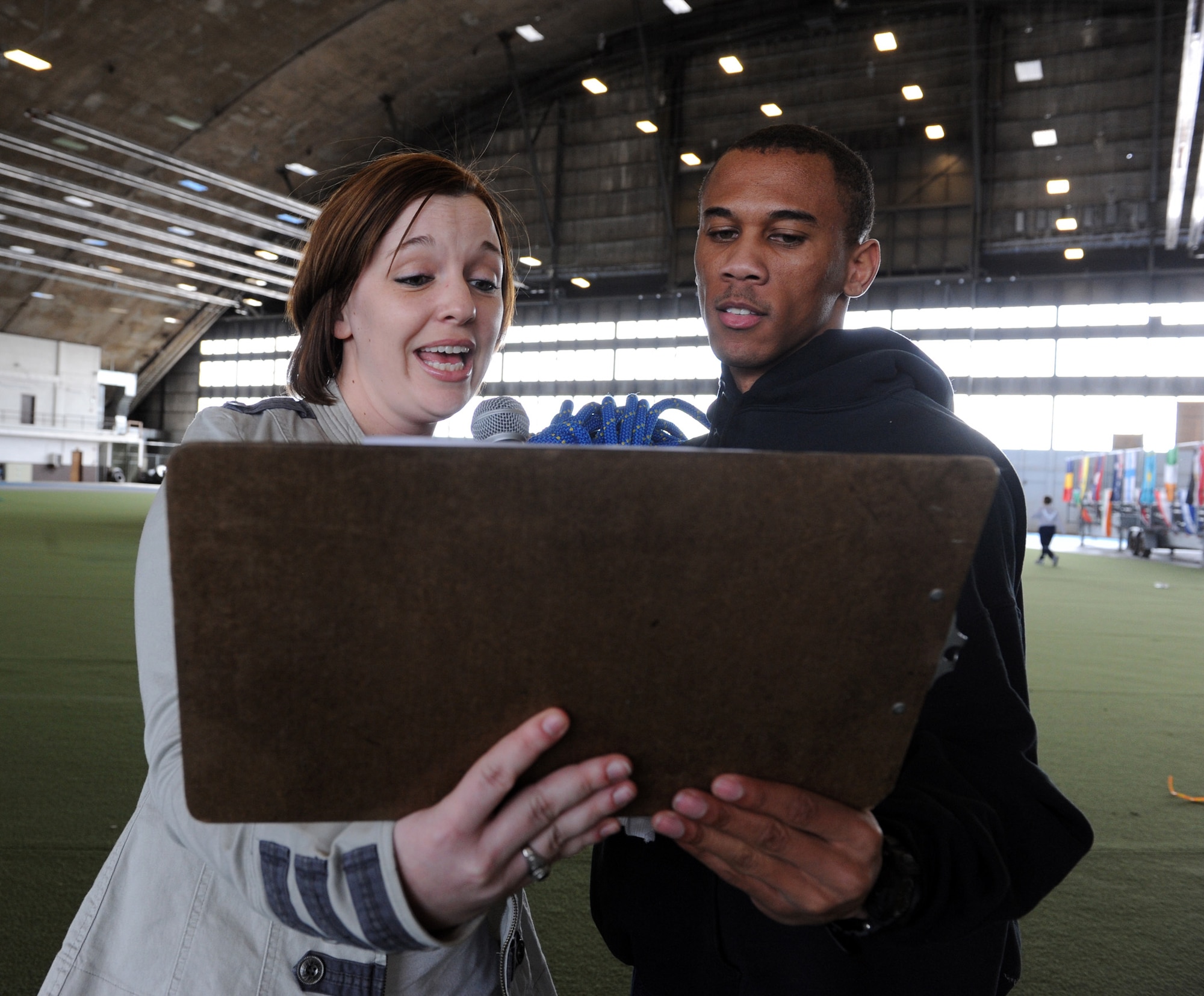 (Left) Staff Sgt. Aleha Will, Air Force Financial Services Center VIP branch, and Airman 1st Class Alvin Jones II, AFFSC reload technician, announce the next sporting event during the Multicultural Day, May 3, 2011, at Ellsworth Air Force Base, S.D. A variety of sporting events, including a relay race, ultimate football, bocce ball, table tennis, sumo wrestling and speed chess, were conducted throughout the day. (U.S. Air Force photo/Senior Airman Adam Grant)  