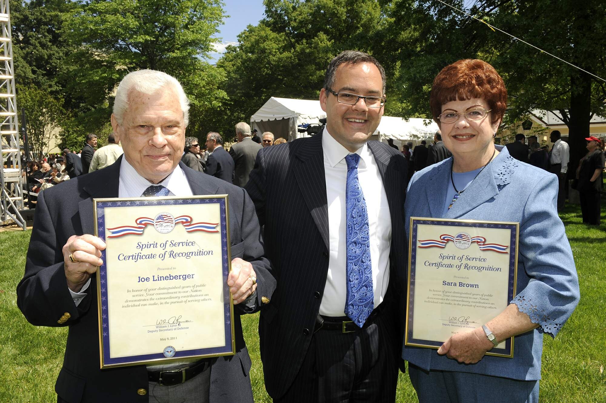 Daniel Ginsberg, the assistant secretary of the Air Force for manpower and
reserve affairs (center), shares in celebration with Joe Lineberger and Sara
Brown during a ceremony honoring them for 50 years of public service May 5, 2011, in the Pentagon courtyard.  Mr. Lineberger is a senior executive and
works under Mr. Ginsberg. Ms. Brown works for Air Force Materiel Command. There were about 50 Department of Defense civilians honored in the ceremony, some with more than 60 years of service.  (U.S. Air Force photo/Scott Ash)