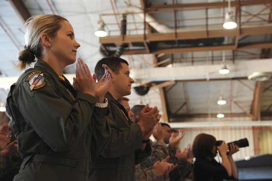SEYMOUR JOHNSON AIR FORCE BASE, N.C. -- Airmen from the 4th Fighter Wing cheer for a Bronze Star Medal recipient here, May 6, 2011. Secretary of Defense Robert M. Gates presented the medal to Senior Master Sgt. Arnel Abad for his accomplishments during a recent deployment to Afghanistan. (U.S. Air Force photo/Senior Airman Whitney Lambert) (RELEASED)