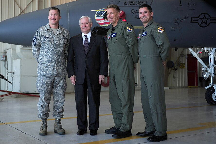 SEYMOUR JOHNSON AIR FORCE BASE, N.C. -- Secretary of Defense Robert M. Gates poses with Command Chief Master Sgt. Blake Malpass, 4th Fighter Wing commander Col. Patrick Doherty and vice commander Col. Shawn Pederson here, May 6, 2011. Secretary Gates presented his coin to more than 300 Airmen. (U.S. Air Force photo/Senior Airman Rae Perry)(RELEASED)