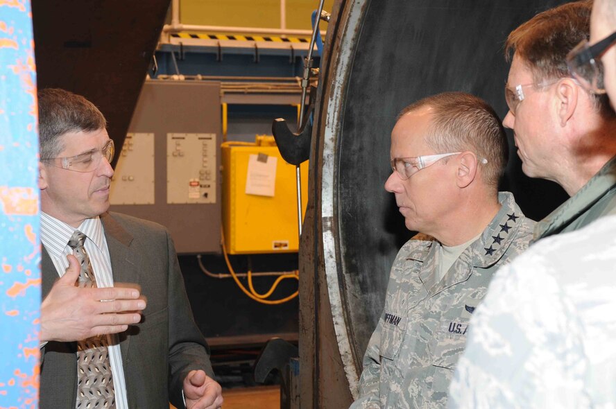 White Oak Technical Director John Lafferty, left, describes the operation of AEDC’s Tunnel 9 facility in White Oak, Md., and the data obtained for the Hypersonic Technology Vehicle-2 return to flight program to Gen. Donald Hoffman, commander of the Air Force Materiel Command, while touring the Tunnel 9 facility April 8. (Photo provided)