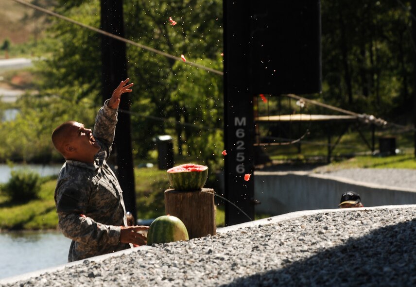 FORT BENNING, Ga. -- A Ranger from the Ranger Training Brigade demolishes a watermelon during a demonstration April 29. Family and friends were able to observe the graduates’ honed skills from the 61-day Ranger School prior to the ceremony where each Ranger had their coveted tab pinned on. (U.S. Air Force photo/Airman 1st Class Brigitte N. Brantley-Sisk)