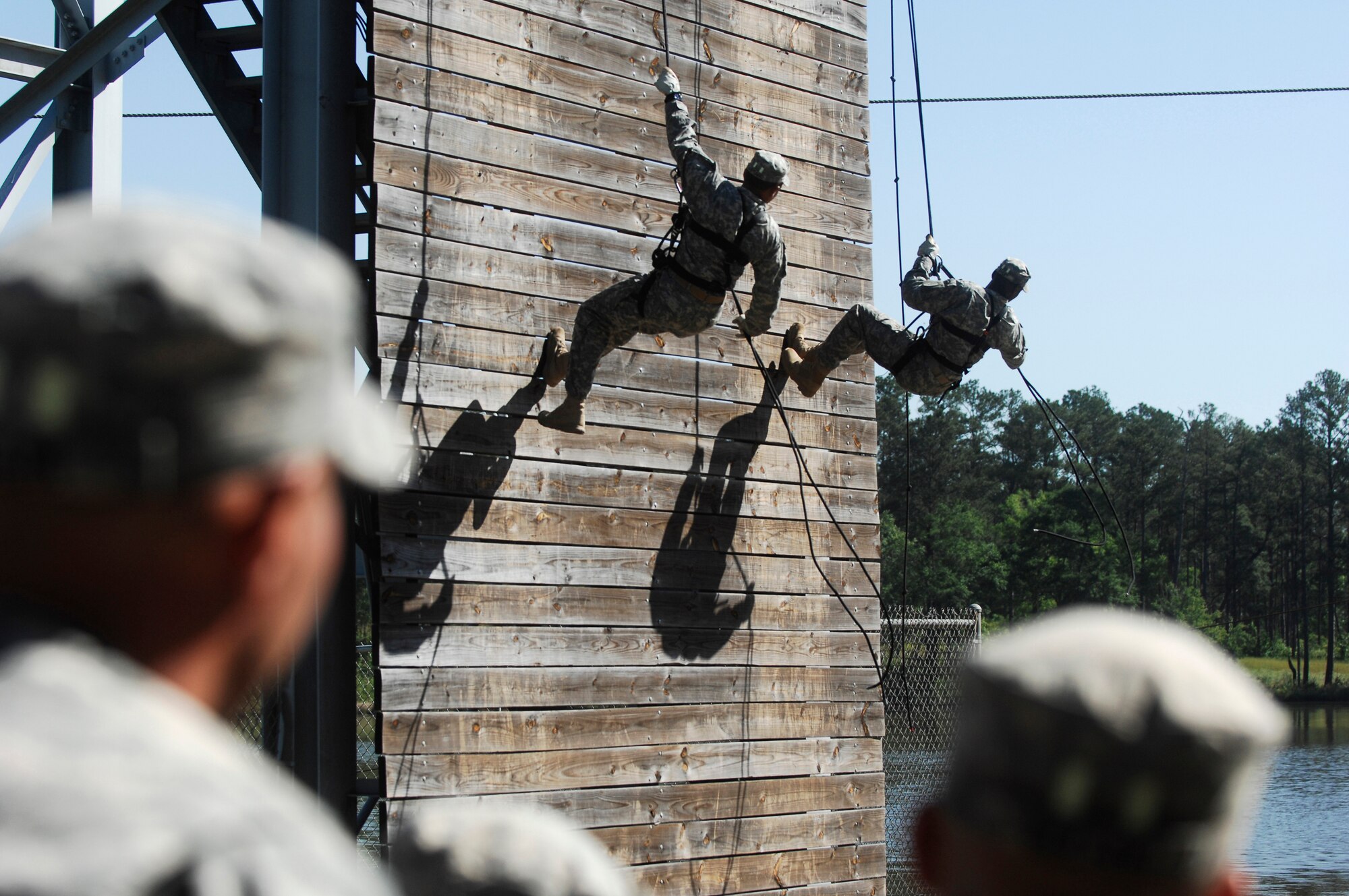 FORT BENNING, Ga.-- Two prior Ranger graduates from the Ranger Training Brigade demonstrate rappelling during a demonstration April 29 preceding the official graduation ceremony. The audience also observed demolitions demos and hand-to-hand combat as a way to understand what the service members went through during the 61-day Ranger training course. (U.S. Air Force photo/Airman 1st Class Brigitte N. Brantley-Sisk)(RELEASED) 
