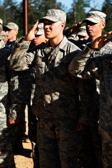 FORT BENNING, Ga. -- Airman 1st Class Matthew Garner, 823rd Base Defense Squadron member, salutes during the playing of the national anthem at Fort Benning, Ga., April 29. Airman Garner is one of fewer than 300 Airmen ever to receive a Ranger tab and will attend the U.S. Army Airborne School at the end of May in hopes of becoming an Airborne Ranger. (U.S. Air Force photo/Airman 1st Class Brigitte N. Brantley-Sisk)