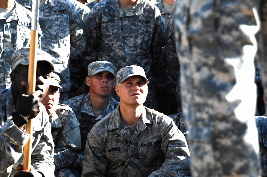 FORT BENNING, Ga. -- Airman 1st Class Matthew Garner, 823rd Base Defense Squadron member, listens to a last-minute speech from a Ranger Training Brigade leader April 29. The Ranger graduation ceremony was preceded by a Rangers in Action Demonstration and attended by hundreds of friends and families. (U.S. Air Force photo/Airman 1st Class Brigitte N. Brantley-Sisk)