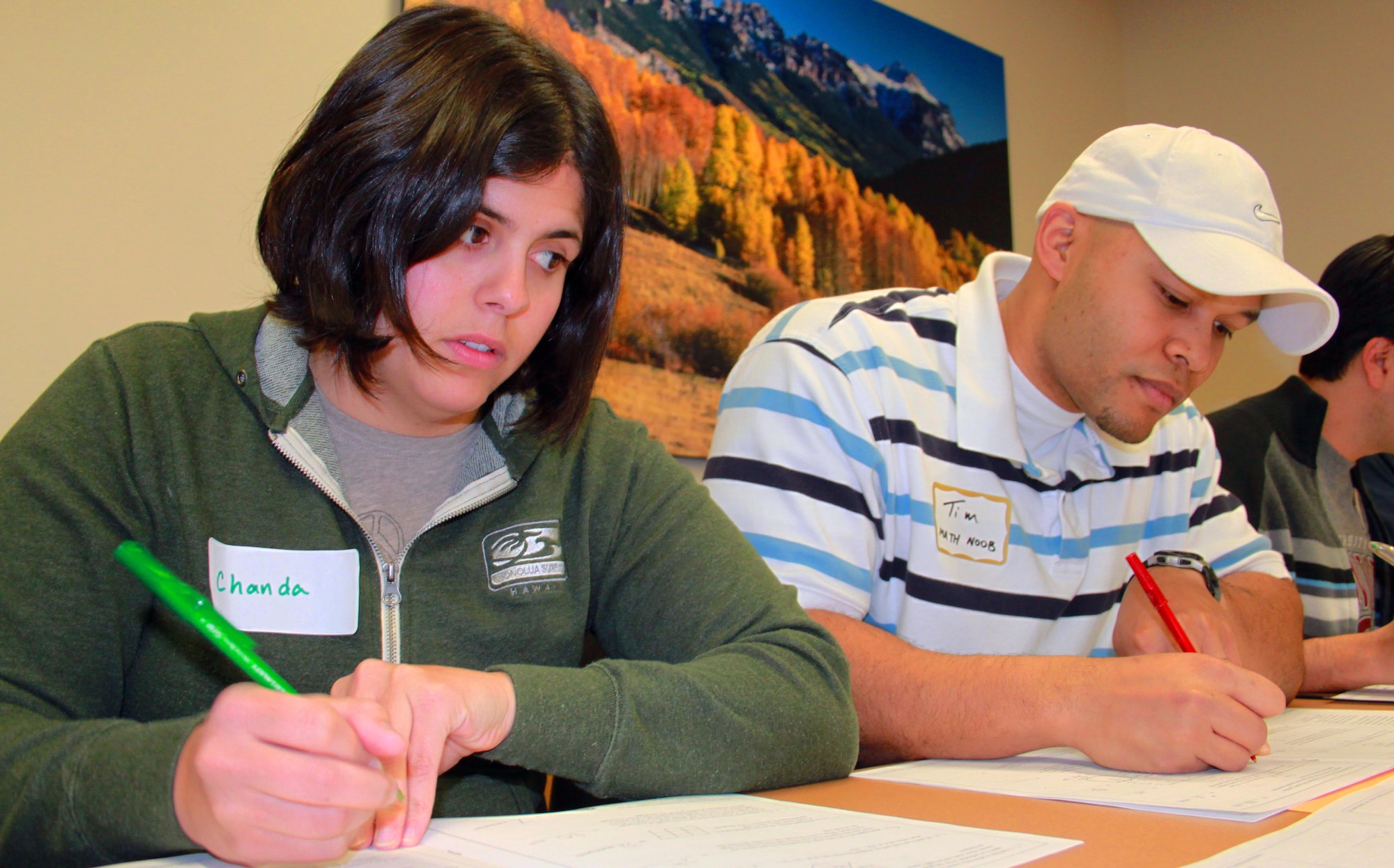 Tech. Sgts. Chanda Zazi and Tim Baptist score test sheets during the 2011 MATHCOUNTS state competition at Denver University in Denver on March 12. Individual and team winners from regional MATHCOUNTS events across Colorado competed for a chance to compete at the national competition May 5-8 in Washington, D.C. (U.S. Air Force photo by Tech. Sgt. Scott P. Farley)