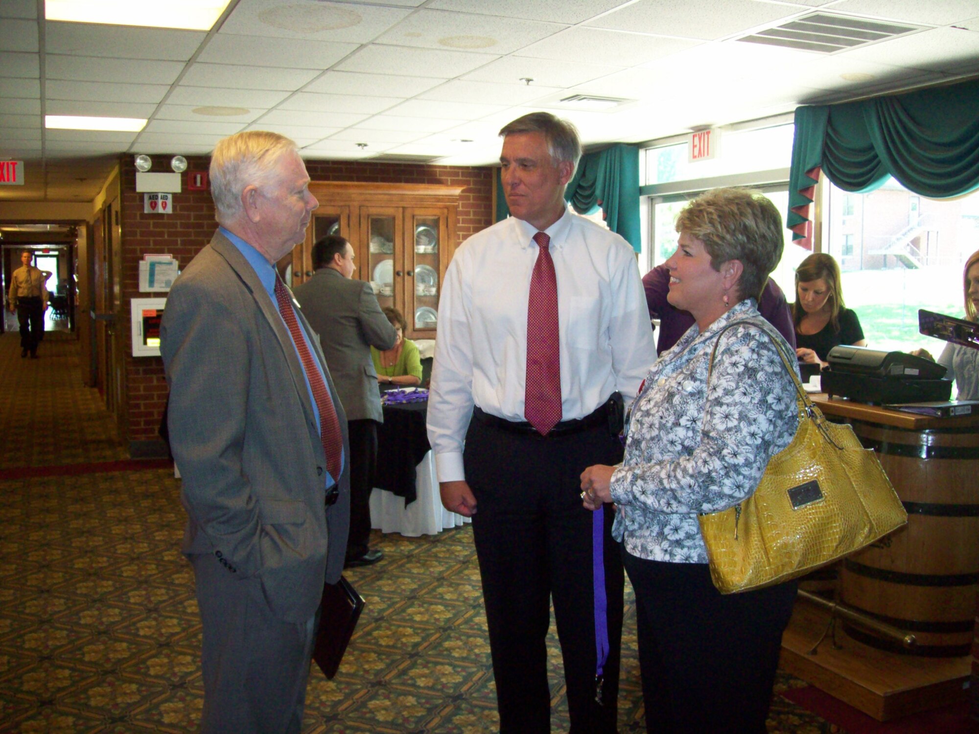 TTU President Dr. Robert Bell greets AEDC employees John and Michelle Sutton prior to the alumni luncheon May 4 at the Arnold Lakeside Center (ALC). John, a Tech graduate, is director of AEDC’s Contracting Division. (Photo by: Shawn Jacobs)