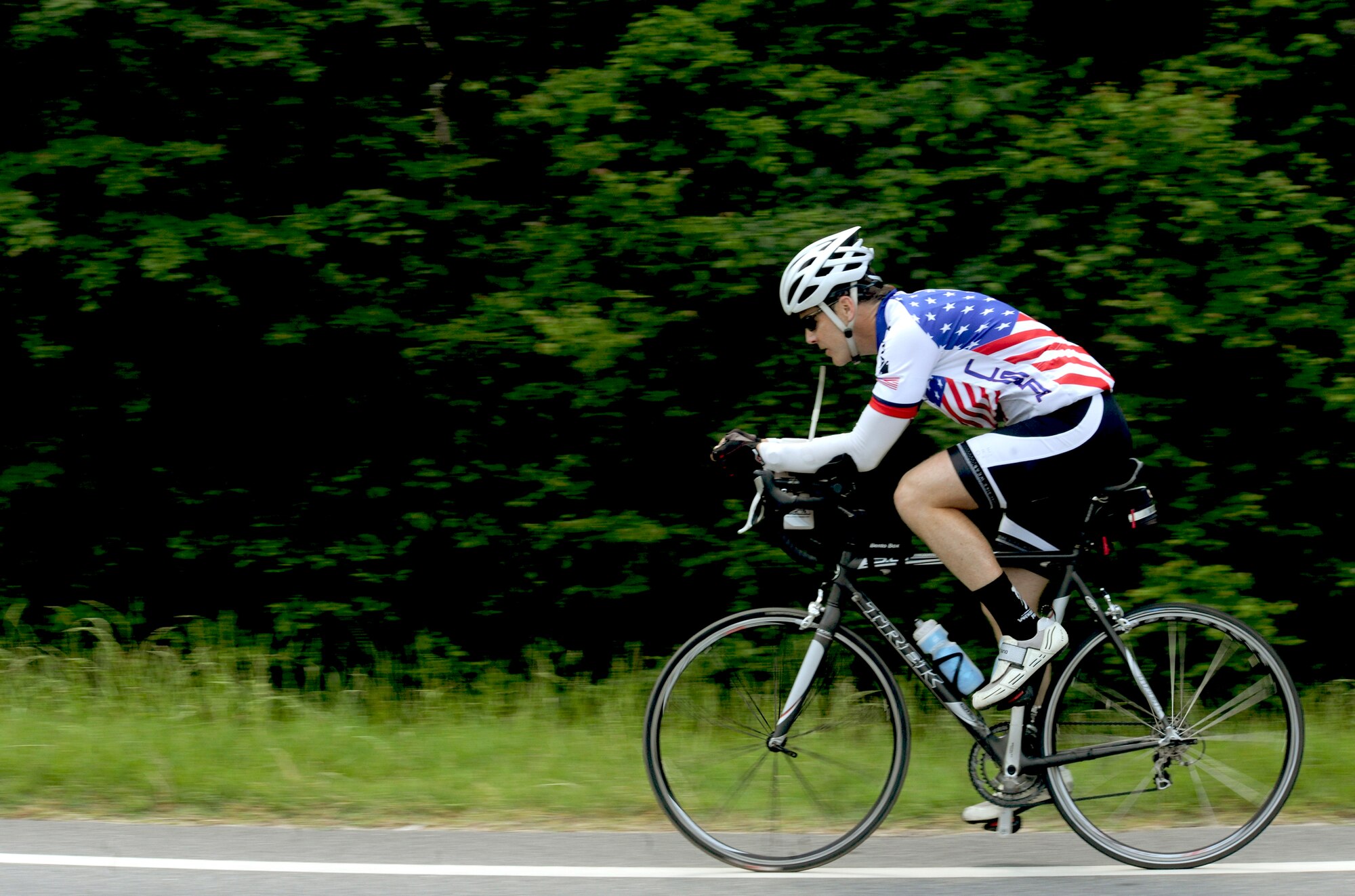 Jason Rogers, an Air Force veteran, rides his bicycle May 2, 2011, through Hahira, Ga. Mr. Rogers rode his bicycle 2,500 miles across the U.S., to raise money for the Wounded Warrior Project. (U.S. Air Force photo/Airman 1st Class Jarrod Grammel)