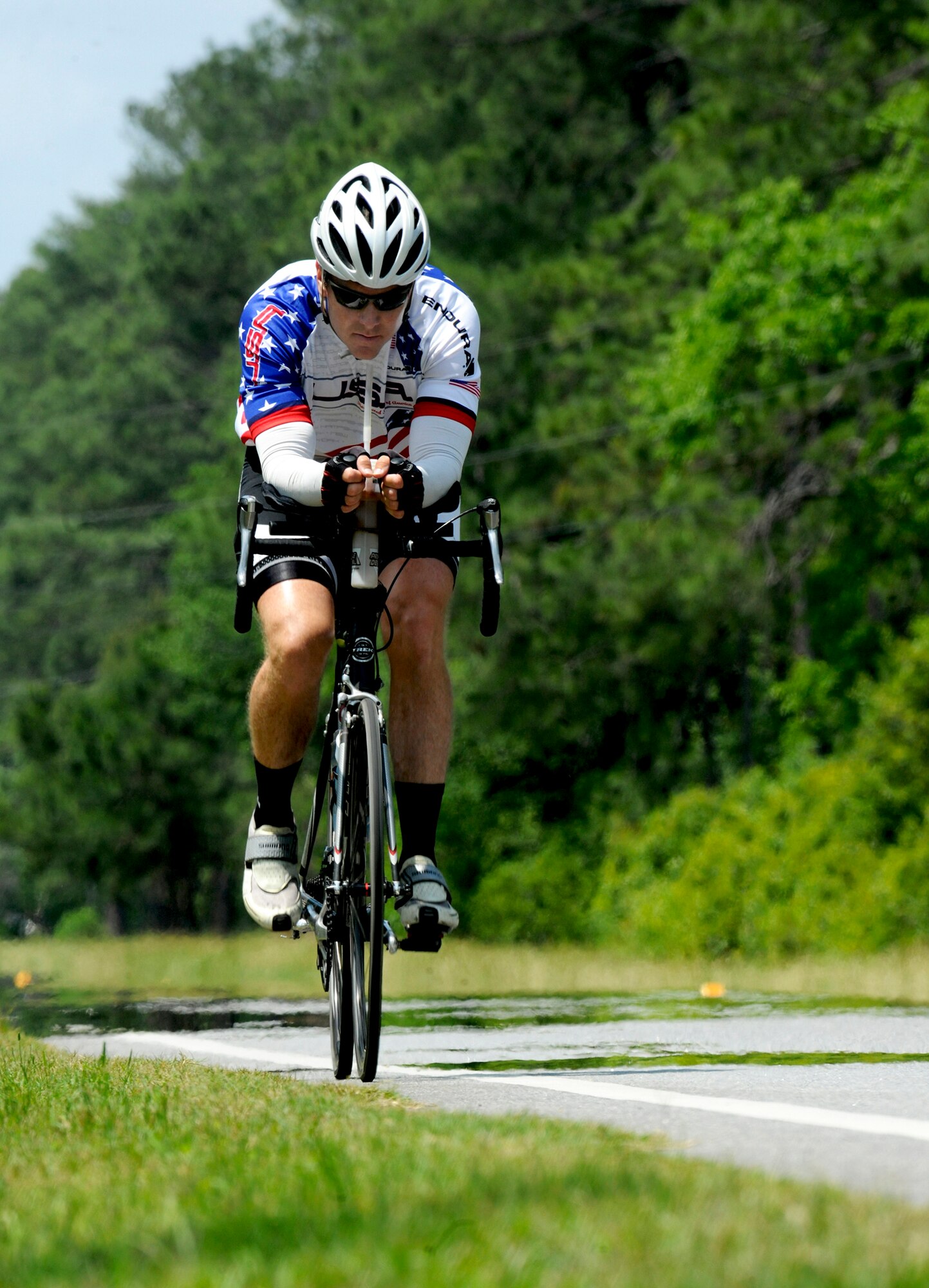 Jason Rogers, an Air Force veteran, cycles through Georgia's heat and humidity May 2, 2011, as he nears the finish of his 2,500-mile trip across the U.S. Mr. Rogers was a liquid-fuel-systems maintenance specialist during operations Desert Storm and Shield and decided to ride to raise money for wounded veterans through the Wounded Warrior Program. (U.S. Air Force photo/Airman 1st Class Benjamin Wiseman)