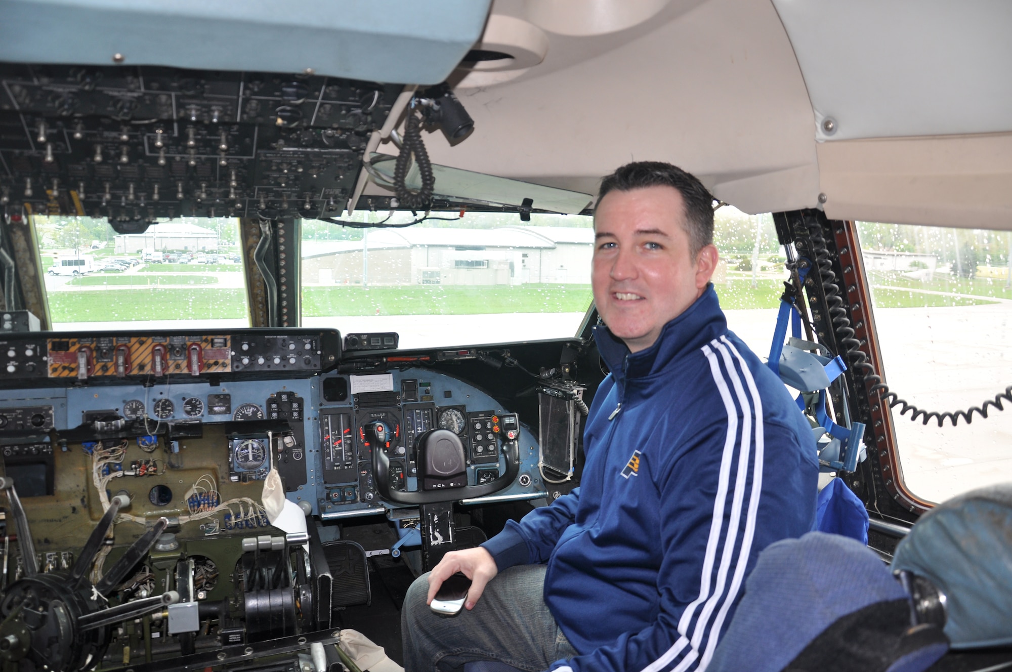 WRIGHT-PATTERSON AIR FORCE BASE, Ohio – Mr. Scott Higginson, Indiana Pacers Corporate Partnership Sales Executive, enjoys the view from the flight deck of a 445th Airlift Wing C-5 Galaxy may 3. Five members of the Indiana Pacers marketing staff toured the aircraft with recruiters from the 338th Recruiting Squadron as part of the 338th RCS’s partnership program called Indiana Pacers Dip into the Blue, which gives the Pacers organization a better understanding of what the Air Force does and why it’s important to partner with them. (U.S. air Force photo/Stacy Vaughn)