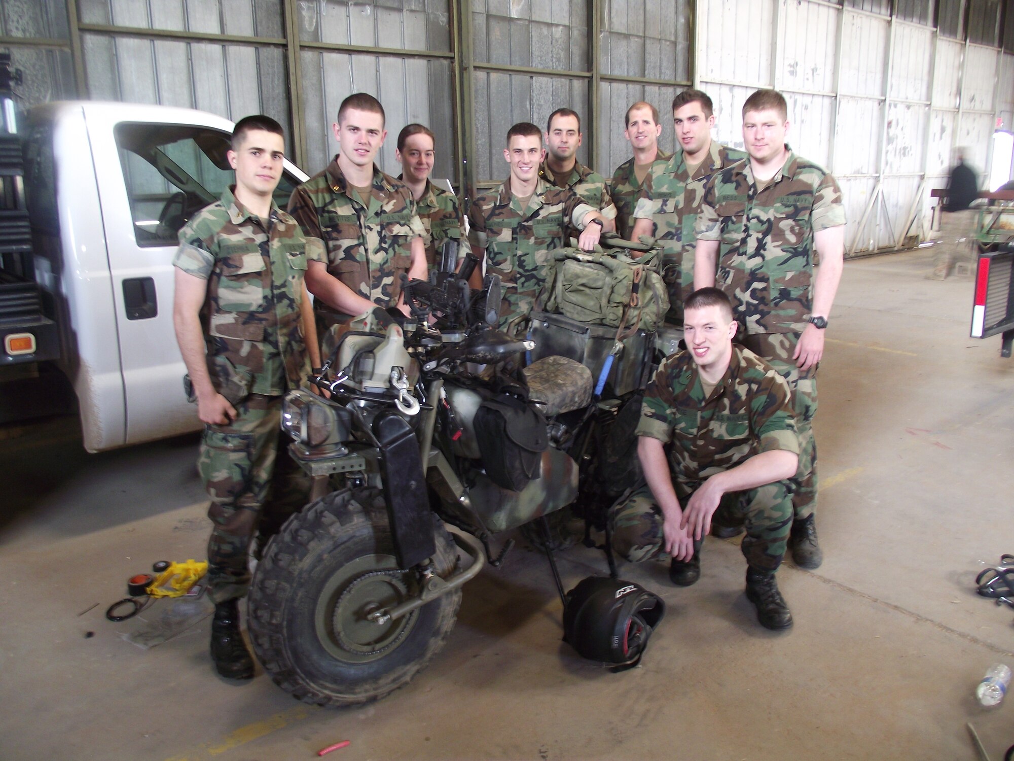 The U.S. Naval Academy team participating in the Air Force Research Laboratory’s 2011 Rapid Reaction Challenge, conducted in the southeastern portion of Kirtland Air Force Base, stands next to their Trailbreaker device, a two-wheel, all-terrain vehicle with a 172-cc engine with 6.6 horsepower that can achieve a top speed
of 35 miles per hour. The USNA won the Service Academies’ competition. The Rapid Reaction Challenge occurred April 15-27.