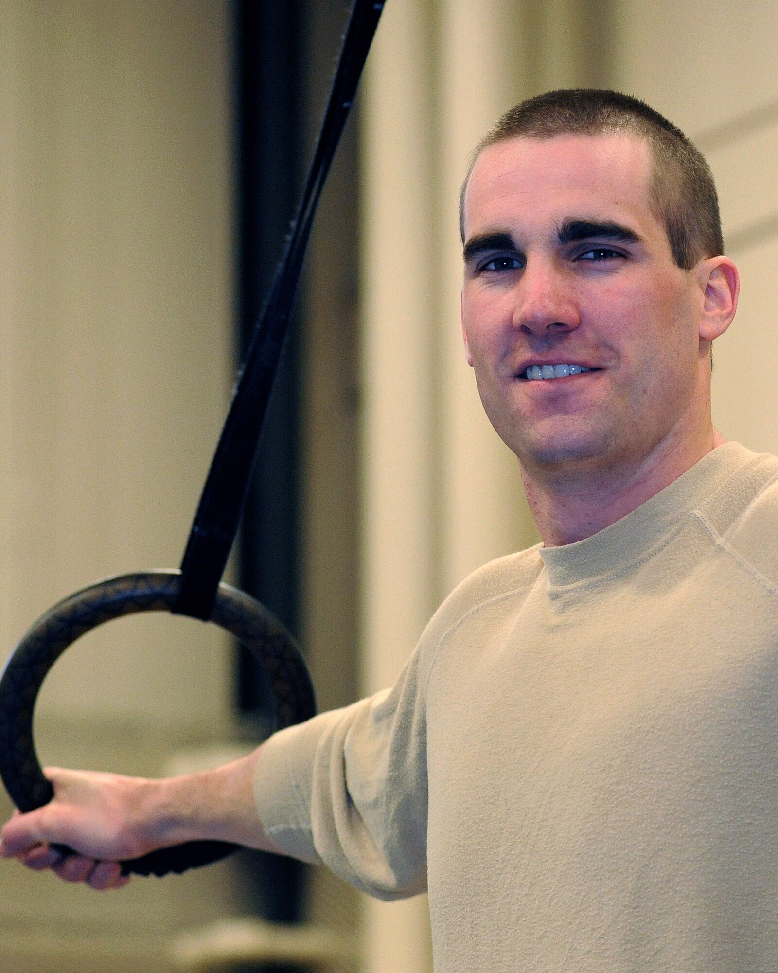 2nd Lt. Miles Ryan, 319th Civil Engineering Squadron, poses on the Olympic rings May 4 at the fitness center here. Ryan was named Grand Forks Air Force Base male Athlete of the Year for 2010. Nominations are made based on outstanding performance in sports and fitness, assigned duties and performance in the community. (U.S. Air Force photo by Airman 1st Class Amber Bennett)