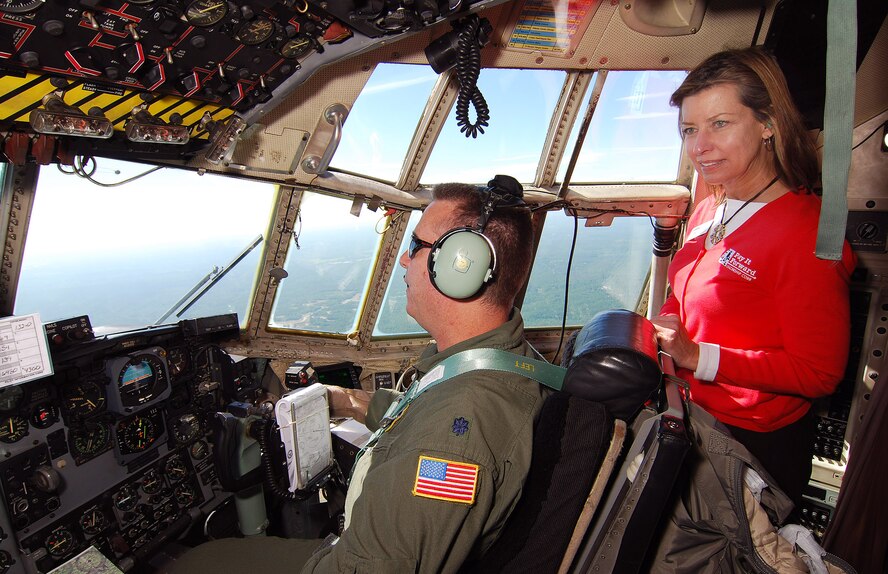 Judy Skeel gets a good look at the northwest Georgia region over the C-130H2 copilot, Lt. Col. Scott Benson's shoulder during the Leadership Cobb familiarization flight, May 5.  Participants in Leadership Cobb had this rare opportunity during their visit to the 94th Airlift Wing and Dobbins Air Reserve Base.    (U.S. Air Force photo/ Brad Fallin)