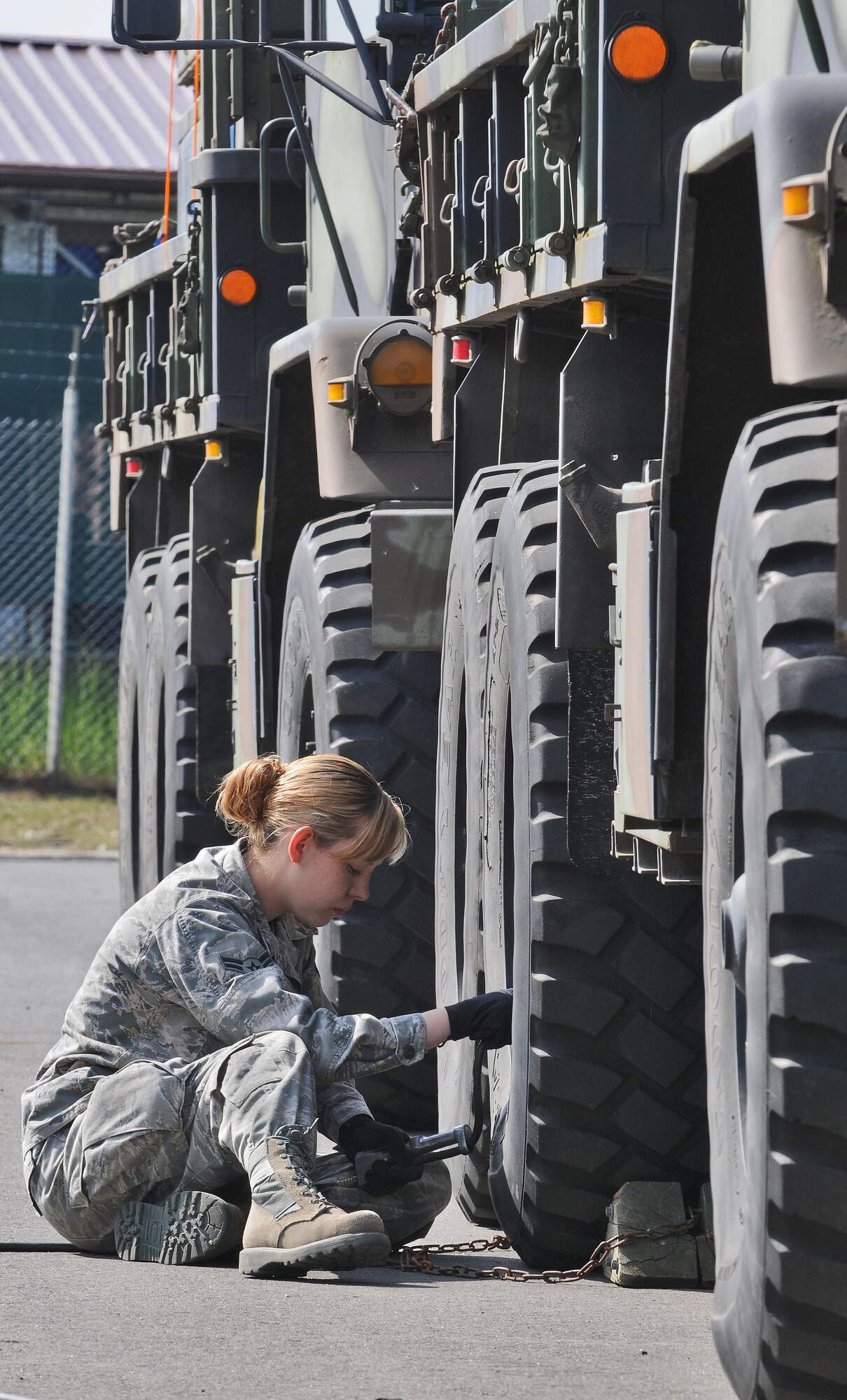 SPANGDAHLEM AIR BASE, Germany – Airman 1st Class Victoria Sutherland, 606th Air Control Squadron surveillance technician, pumps air into the tire of a tactical vehicle here May 3 in preparation for an Eifel Thunder exercise. The exercise will test the ability of Airmen to take all their equipment out to a simulated deployed location where they will live and work as if they are on a real deployment. (U.S. Air Force photo/Senior Airman Nick Wilson)