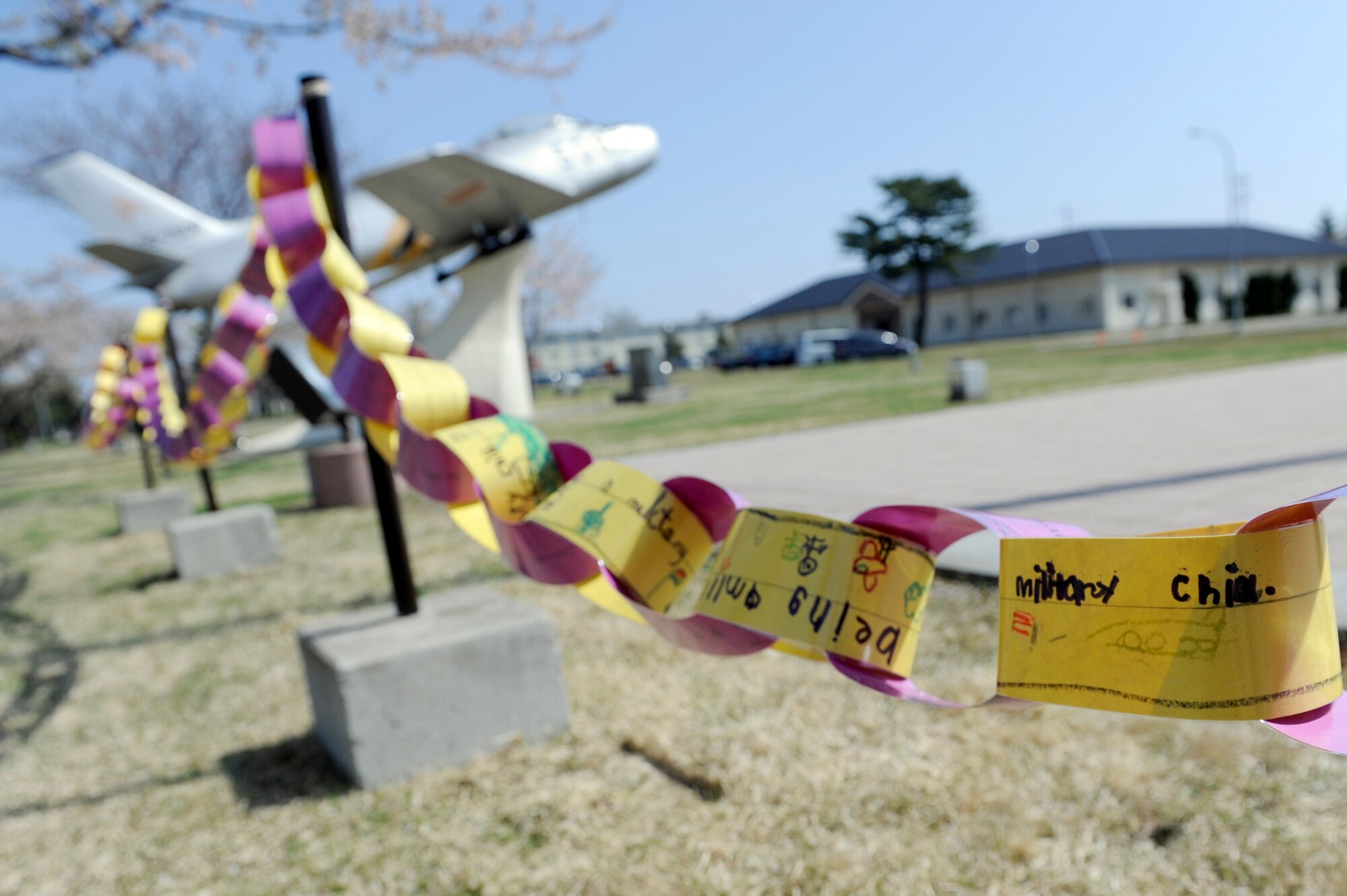 MISAWA AIR BASE, Japan -- Links decorated by Cummings Elementary School students sway in the wind May 6. Approximately 200 links were decorated and displayed at the base flag pole in honor of the Month of the Military Child. Each April, Americans pause to recognize the nation's 1.8 million military children during the Month of the Military Child, which marks its 25th anniversary this year. (U.S. Air Force photo/Staff Sgt. Marie Brown/Released)