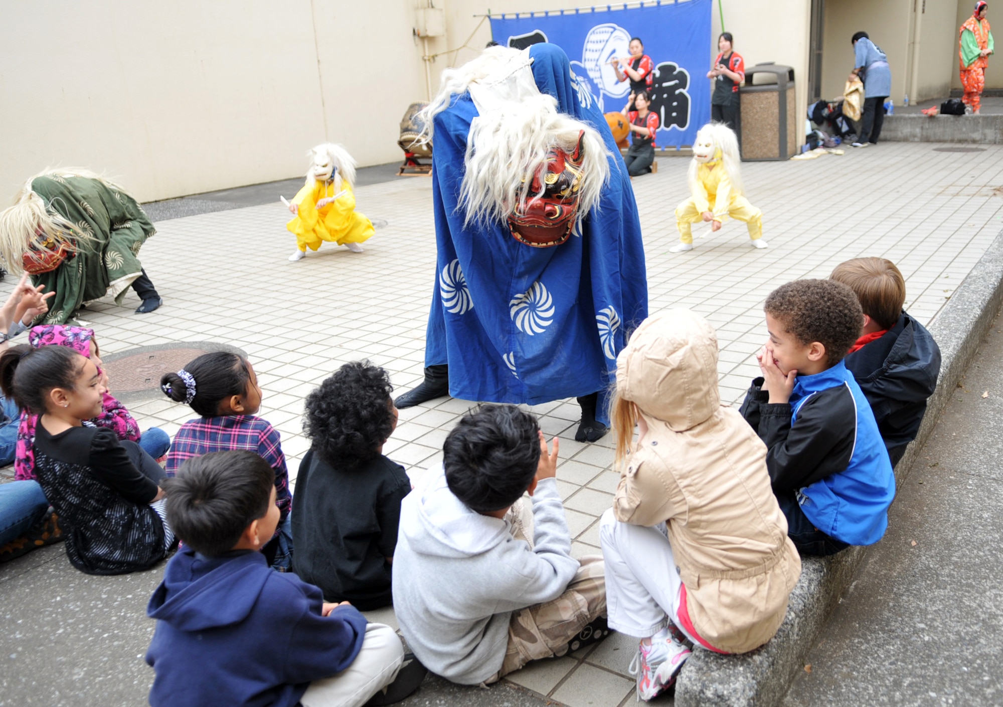 YOKOTA AIR BASE, Japan -- Yokota West Elementary students watch as Ohayashi Dancers perform at Yokota Air Base, Japan, May 5, 2011. The Ohayashi Dancers shared part of their Japanese culture with students during the multicultural event. (U.S. Air Force photo/Airman 1st Class Krystal M. Garrett) 

