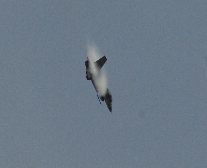 MISAWA AIR BASE, Japan – Capt. Christopher Nations, 14th Fighter Squadron pilot, points his F-16 Fighting Falcon nose-low and banks right, performing a high-G turn May 6. The maneuver is part of a 14th FS demo team practice. As the aircraft turns hard through the sky, water vapor is compressed against the body of the aircraft, creating the familiar condensation trails associated with aircraft flight. (U.S. Air Force photo\Tech. Sgt. Phillip Butterfield)