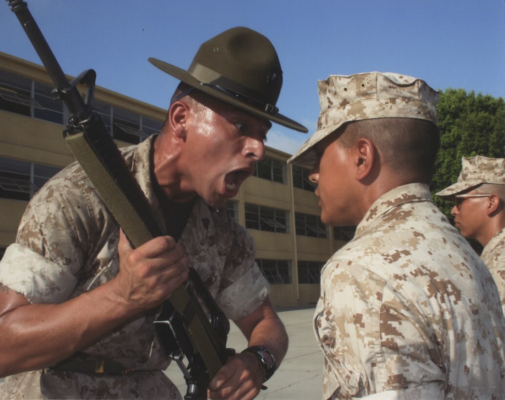 Staff Sgt. Michael Saldana, 1st Battalion's drill master, corrects a recruit during a senior drill instructor inspection. Saldana was nominated as 1st Battalion's Drill Instructor of the Year for the entire Marine Corps and was awarded by the Marine Corps Recruit Depot San Diego Museum Historical Society April 26.