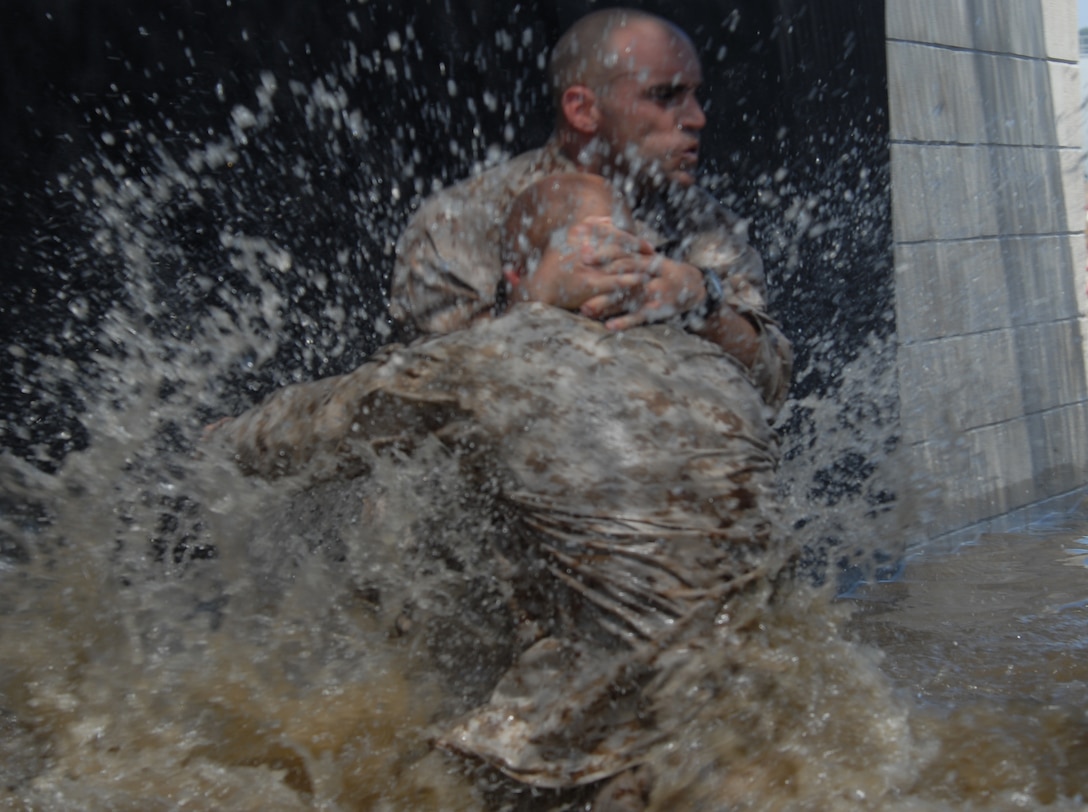 Sgt. Dennis Joy grapples with his opponent in the bear pit May 6 aboard Marine Corps Recruit Depot San Diego. The bear pit is one training exercise during the Martial Arts Istructor course being held here.