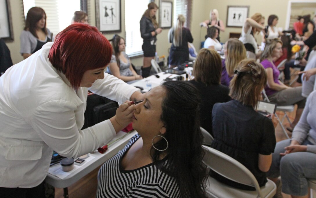 Military spouse Cynthia Munoz, enjoys a free makeover during a free pampering session hosted by the San Onofre Housing Office, May 6. Moms also had a chance to win numerous prizes such as kitchen appliances, garden decorations, make-up kits and beauty supplies during a free raffle.
