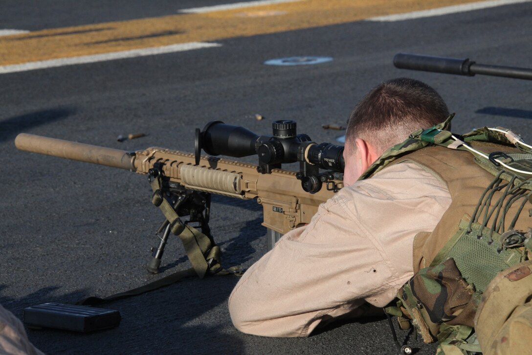 A Marine with Force Reconnaissance platoon, 22nd Marine Expeditionary Unit, fires an M110 sniper rifle during a live-fire exercise aboard USS Bataan May 6, 2011.  The Marines and sailors of the 22nd MEU are currently deployed with Amphibious Squadron 6 aboard the USS Bataan Amphibious Ready Group and will continue to train and improve the MEU’s ability to operate as a cohesive and effective Marine Air Ground Task Force.  The 22nd MEU is a multi-mission capable Marine Air Ground Task Force comprised of Aviation Combat Element, Marine Medium Tilt Rotor Squadron 263 (Reinforced); Logistics Combat Element, Combat Logistics Battalion 22; Ground Combat Element, Battalion Landing Team, 2nd Battalion, 2nd Marine Regiment; and its command element.