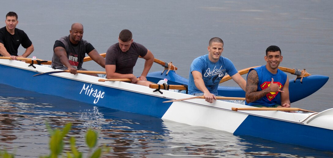 Protocol, a canoe racing team composed of Marines from the Office of the Staff Secretary, U.S. Marine Corps Forces, Pacific, pull into the marina after taking second place in the first heat of the 2011 All Military Canoe Regatta men’s division May 7 at the Rainbow Bay Marina, here. (From left to right ) Gunnery Sgt. Scott Smith, Staff Sgt. Kevin Bigelow, Cpl. Joseph McVey, Capt. Rob Irving and Sgt. Luis SosaGuerrero decided to form a team after they received a taste of the sport during a physical training session a month ago.