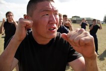 Azbayar Dashzeveg, 21, from Cottage Grove, Minn., listens for the next command while participating in martial arts training during the Recruiting Station Twin Cities mini boot camp May 7. Participants were taught basic movements and strikes from certified Marine Corps martial arts instructors. Dashzeveg, who was born in Ulaanbaatar, Mongolia, attended the three-day boot camp as a guest out of the Woodbury recruiting office. For additional imagery from the event, visit www.facebook.com/rstwincities.