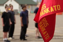 Members of the Delayed Entry Program out of the Mankato recruiting office wait for senior drill instructor Staff Sgt. Brody V. Goldthwaite, 27, from St. Charles, Ill., to deliver the next command while learning drill movements during the Recruiting Station Twin Cities mini boot camp May 7. The Mankato office brought 26 poolees and 12 guests to attend the three-day boot camp. For additional imagery from the event, visit www.facebook.com/rstwincities.