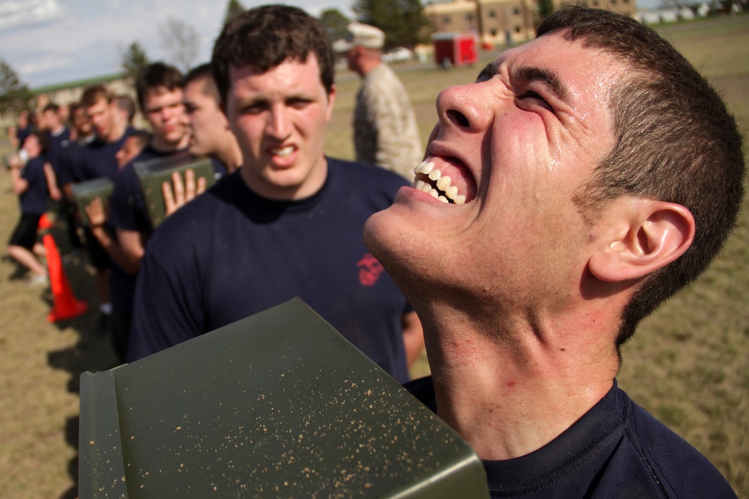 Fritz S. Cheung, 25, from Chaska, Minn., strives to complete another ammo can lift while taking a modified combat fitness test during the Recruiting Station Twin Cities mini boot camp May 7. Cheung, a 2004 Chaska High School graduate, ships off to boot camp Sept. 19. Cheung was recruited out of the Bloomington office by Sgt. Daniel A. Zevnik. For additional imagery from the event, visit www.facebook.com/rstwincities.