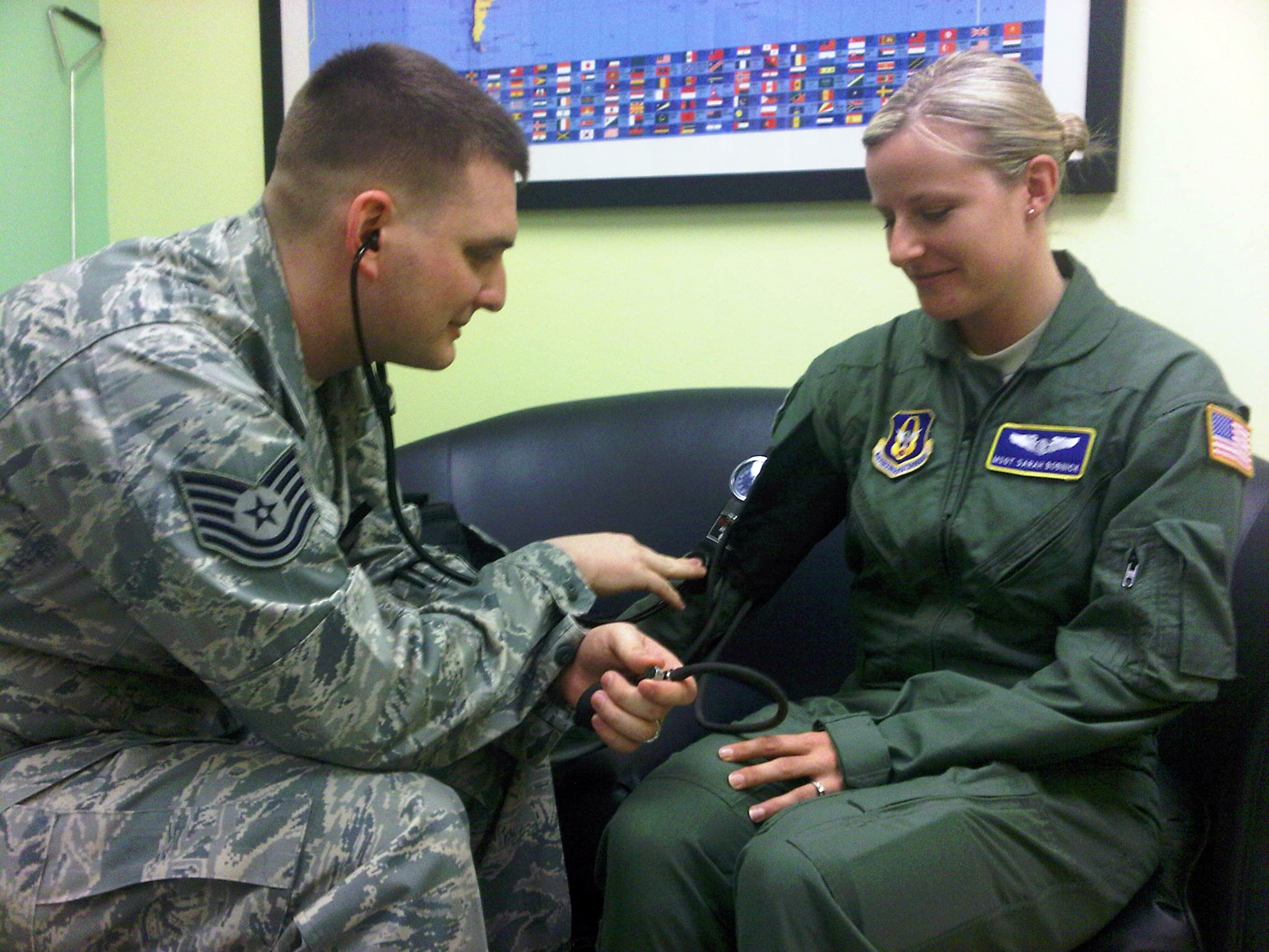 Tech. Sgt. Richard Maser, 446th Aerospace Medicine Squadron, flight medicine technician here, helps Reservists like Master Sgt. Sarah Bobnick, 446th Aeromedical Evacuation Squadron, emergency medical technician, maintain individual medical readiness.  Ensuring Reservists are medically ready to deploy through a web-based Preventive Health Assessment/Individual Medical Readiness is an important part of the 446th AMDS mission supporting rapid global mobility. (U.S. Air Force photo by Staff Sgt. Elizabeth Moody)