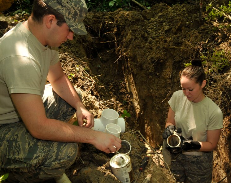 Airman 1st Class Aaron Brehm, a from.., assembles plumbing parts? here May 6 to repair a sewage pipe. Members from the 176th Wing were in Alabama for an Innovative Readiness Training (IRT) mission. The IRT program allows for real-world training opportunities for military personnel while providing needed services to under-served communities in the United States