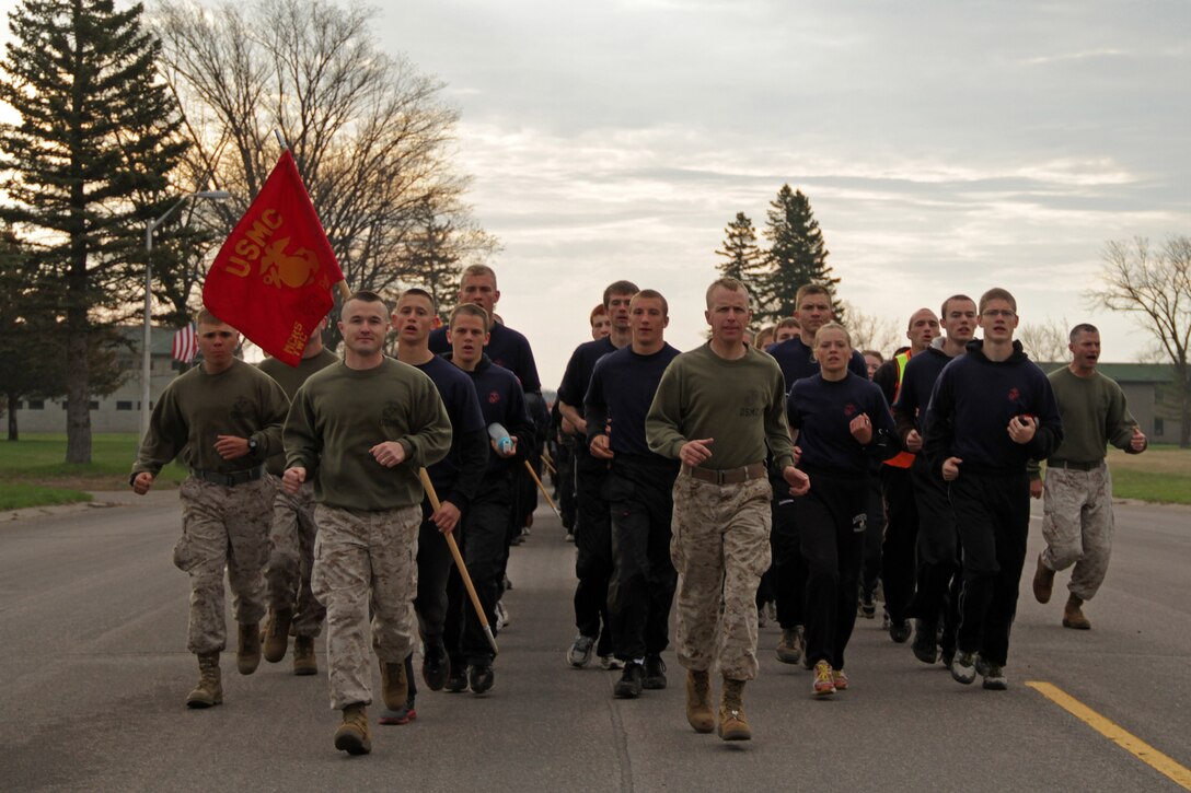 Recruiting Station Twin Cities Commanding Officer Maj. Kenneth Gawronski, 35, from Liberty, Mo., and Sgt. Maj. James Kirkland, 44, from Mendota Heights, Minn., lead the mini boot camp moto run May 8 with Recruiting Substation Woodbury and 13 other stations following behind. More than 600 high school and college students from Minnesota, Wisconsin and the Dakotas attended the three-day training evolution. For additional imagery from the event, visit www.facebook.com/rstwincities.