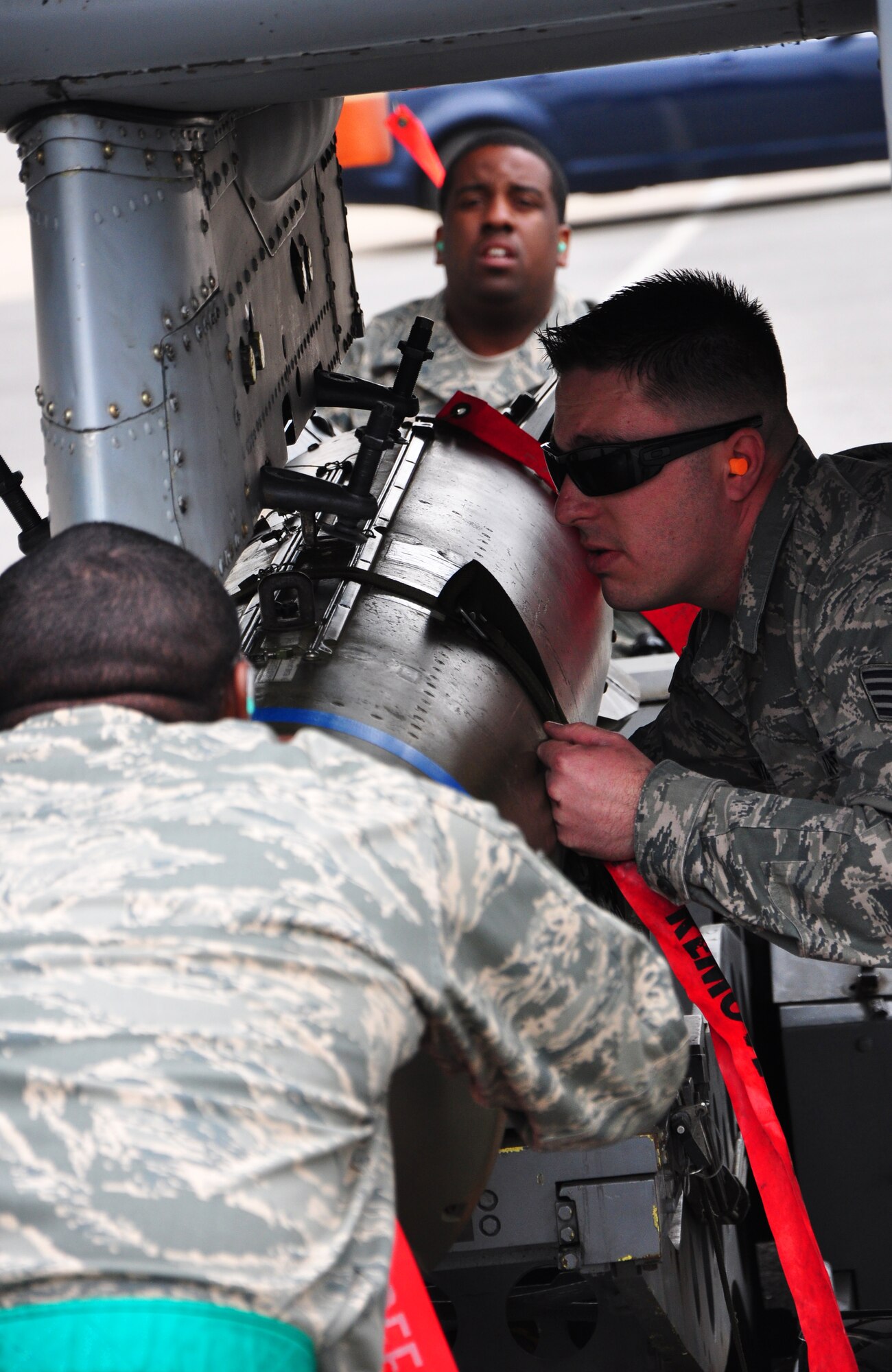 Three weapon load crews clashed May 6 during a quarterly weapon load competition here. Airmen from the 25th Aircraft Maintenance Unit, 36th AMU and 354th Expeditionary Fighter Squadron competed head-to-head loading a Mark-82 general purpose bomb, a CBU-87 air-delivered cluster weapon system and an AIM-9 Sidewinder air-to-air missile during the timed portion of the event. The competition also included a written test and a standards test. (U.S. Air Force photo/Staff Sgt. Chad Thompson)