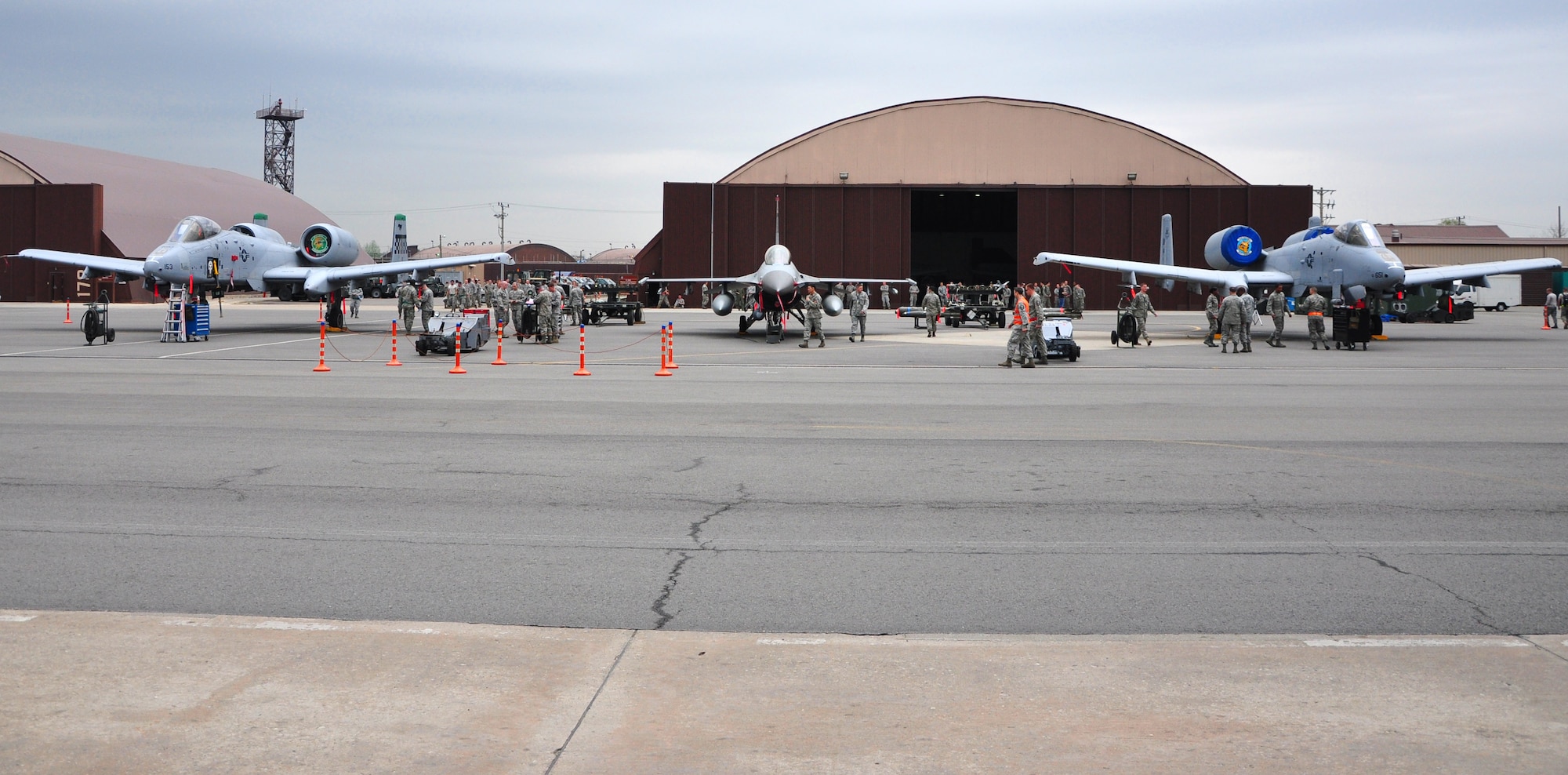 Three weapon load crews clashed May 6 during a quarterly weapon load competition here. Airmen from the 25th Aircraft Maintenance Unit, 36th AMU and 354th Expeditionary Fighter Squadron competed head-to-head loading a Mark-82 general purpose bomb, a CBU-87 air-delivered cluster weapon system and an AIM-9 Sidewinder air-to-air missile during the timed portion of the event. The competition also included a written test and a standards test. (U.S. Air Force photo/Staff Sgt. Chad Thompson)