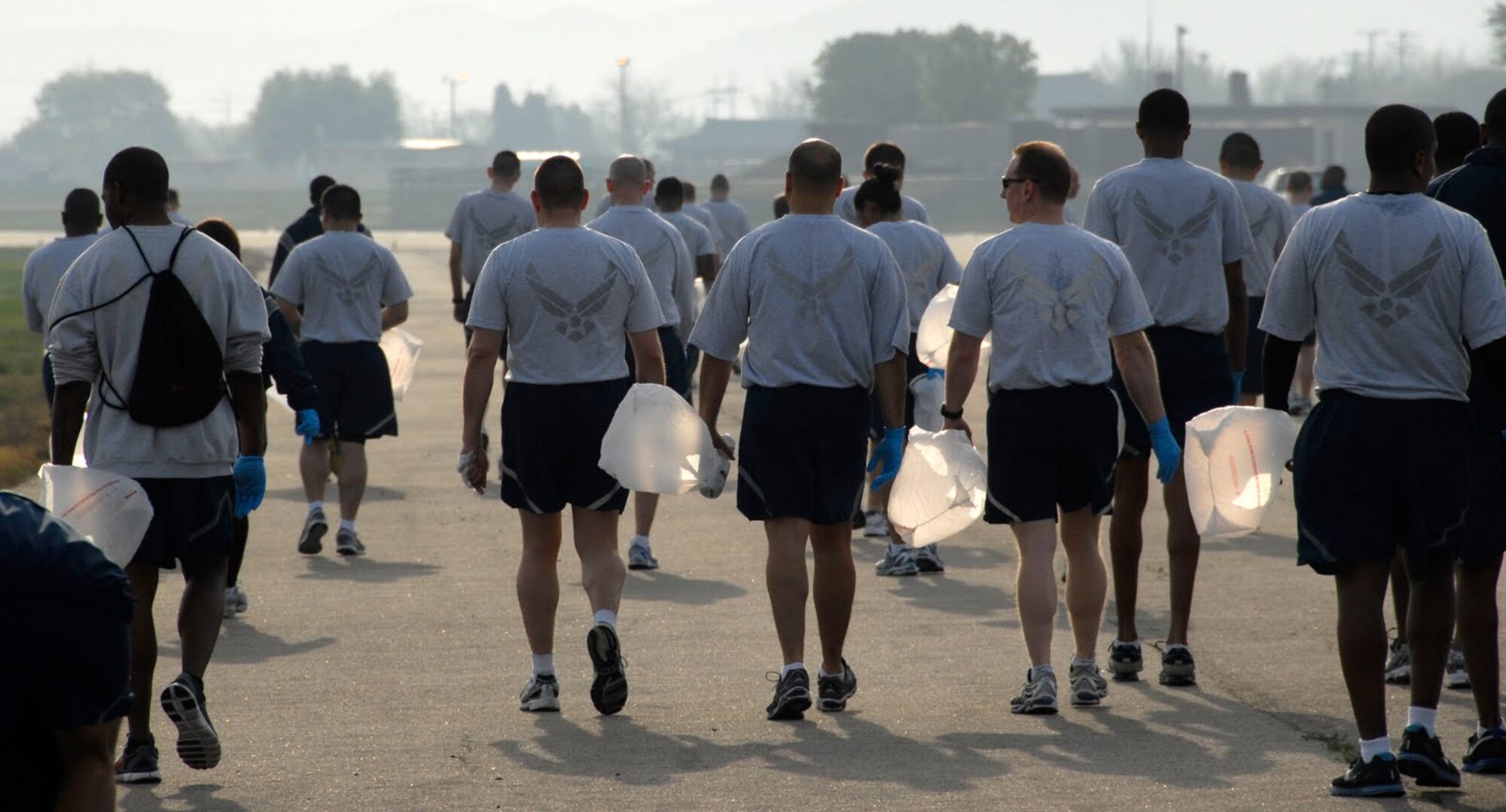 Airmen at Osan participate in a fun-run and foreign object damage walk around the flightline here May 6. The run and FOD walk were sponsored by Air Force Assistant Fund coordinators. The event was used to congratulate the base on an exceptional fund raiser, which brought in more than $153,000 dollars this year. (U.S. Air Force photo/Senior Master Sgt. Paul Holcomb)