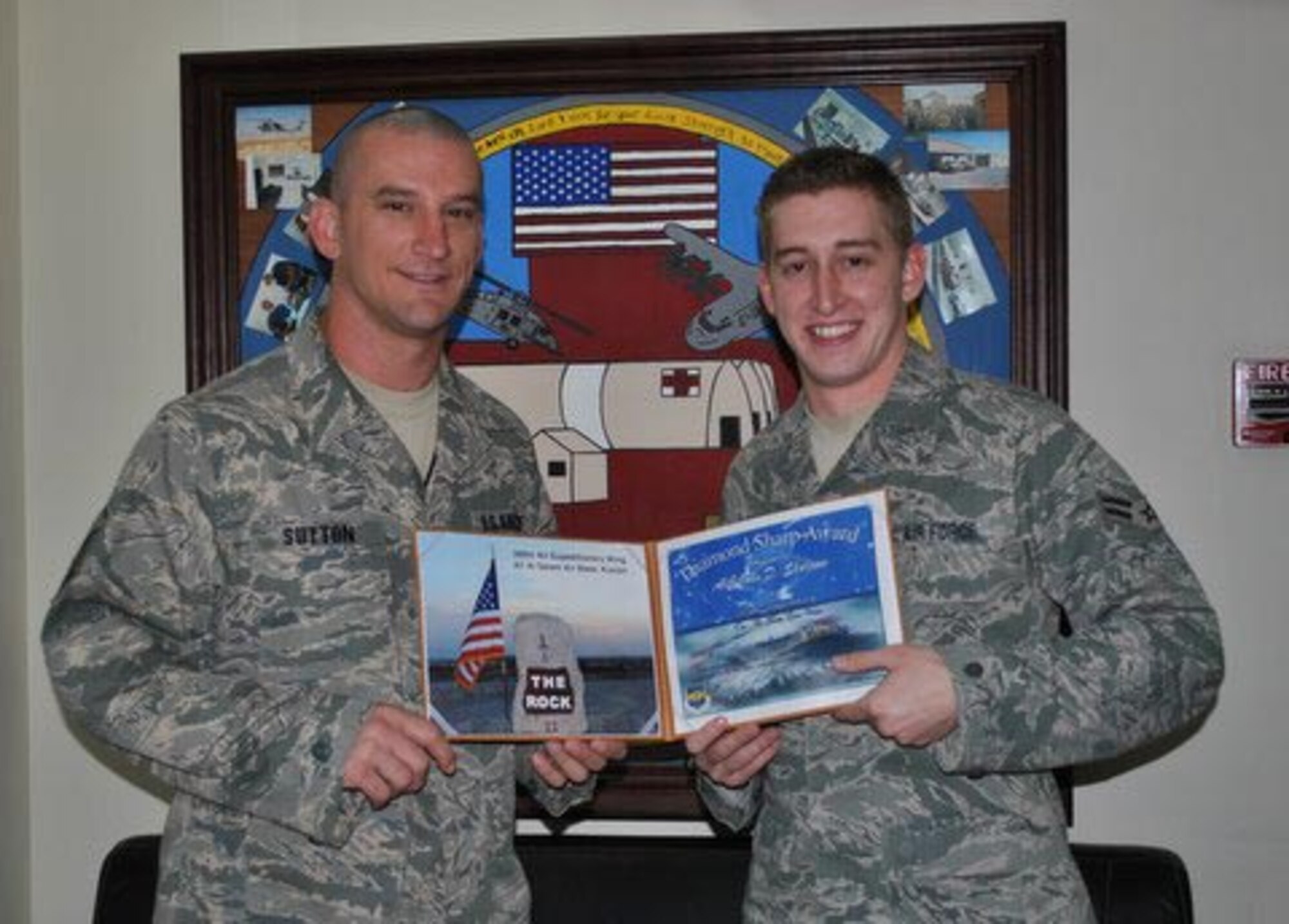 Master Sgt. Jeremiah Sutton presents the Diamond Sharp Award to Airman 1st Class John Sharrow here May 3. Airman Sharrow is an emergency medical technician with the 386th Expeditionary Medical Group deployed from Wright-Patterson Air Force Base, in Ohio, and Sergeant Sutton is the first sergeant for the 386th Expeditionary Operations Group. The accolade is presented to Airmen throughout the 386th Air Expeditionary Wing who go above and beyond in their jobs and show an elevated level of dedication to the mission. (Courtesy photo)