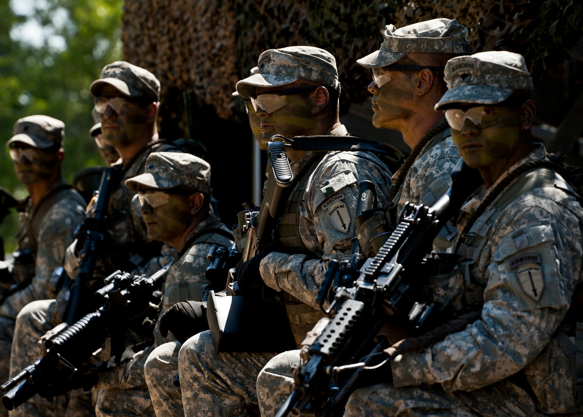 EGLIN AIR FORCE BASE, Fla. -- A squad of Army Rangers in full gear pose for pictures during the  6th Ranger Training Battalion's  60th Anniversary Open House event, May 7.  The event was a chance for the public to learn how Rangers train and operate in extreme situations. The event displays showed dive equipment, weapons, a reptile zoo and zodiac boats.  The demonstrations showed off hand-to-hand combat, a parachute jump, a down-pilot scenario and others. (U.S. Air Force photo/Samuel King Jr.) 