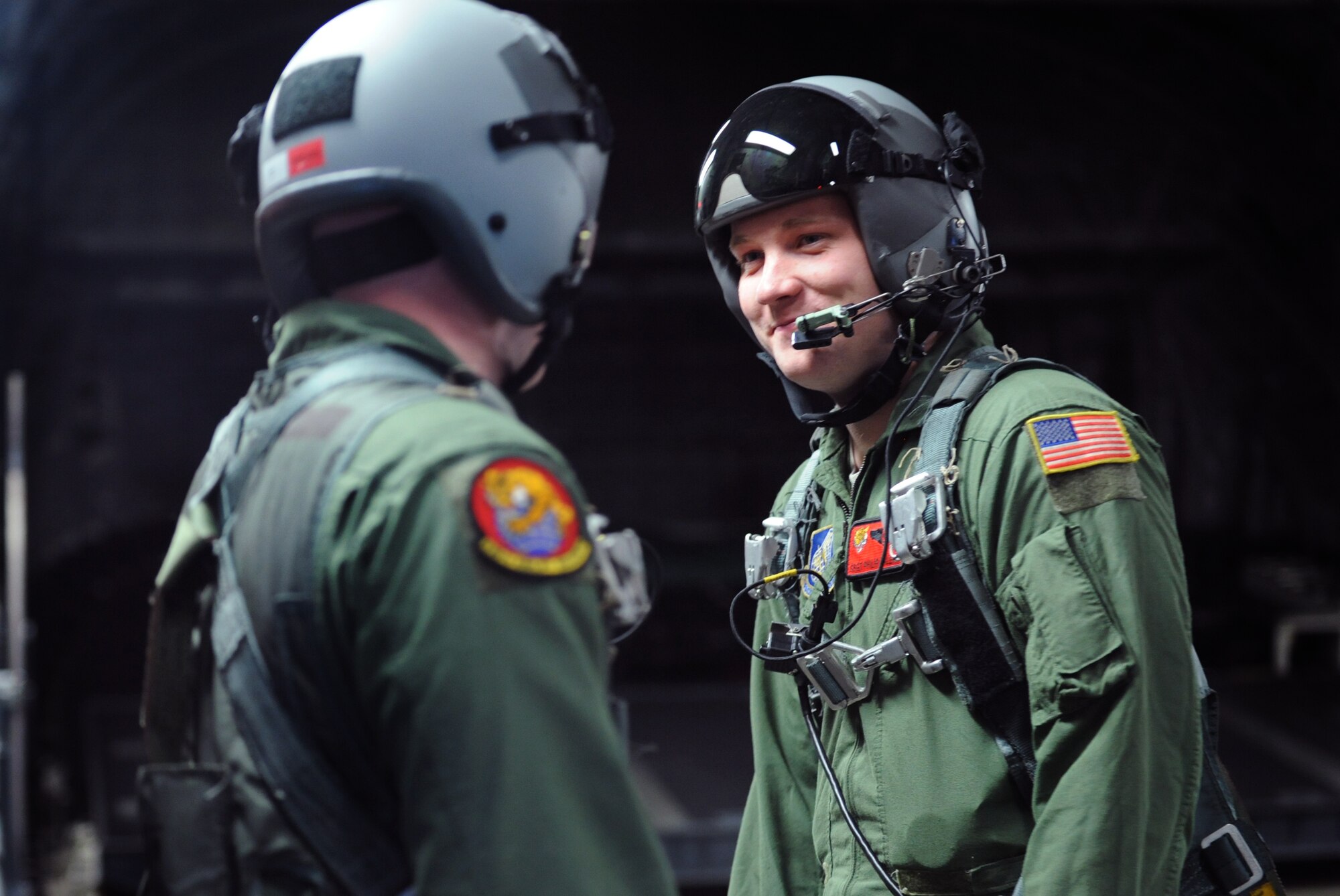 Airman 1st Class Kevin Spears and Staff Sgt. Philip Valenta, loadmasters with the 535th Airlift Squadron, perform final safety inspections on each others harnesses prior to dropping the ramp in flight. The flight contained more than 40 Reserve Officer Training Corps students from the University of Hawaii. During the flight, the cadets were able to witness an in air refueling and the islands of Hawaii from the back of a C-17. (U.S. Air Force photo/Senior Airman Lauren Main)