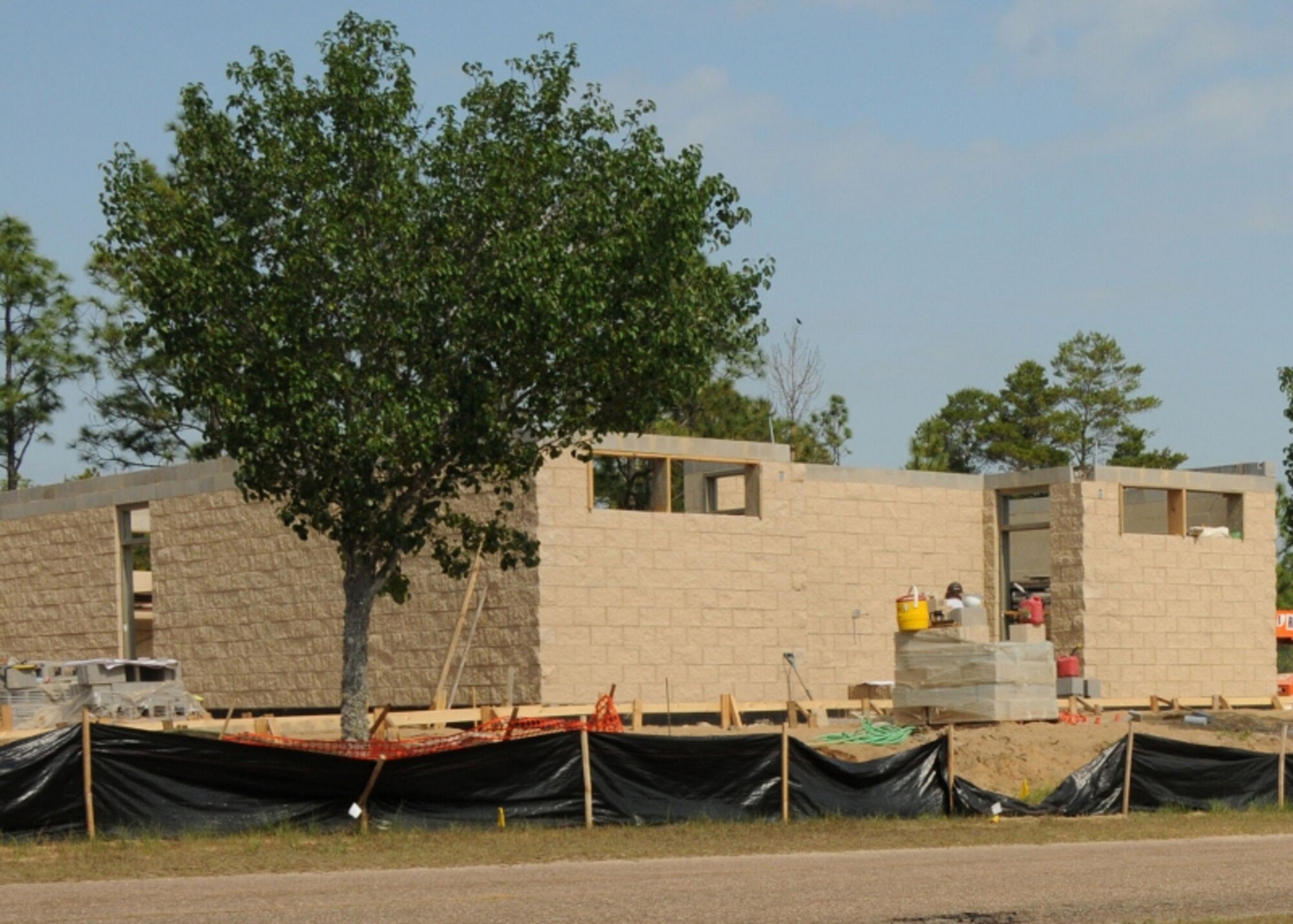 Duke Field’s new field house is taking shape at its construction site adjacent to the base running track.   Expected to be complete by early fall, the facility will include showers, locker rooms and restrooms in a convenient location for those working out at the base’s fitness complex. (U.S. Air Force photo/Adam Duckworth)