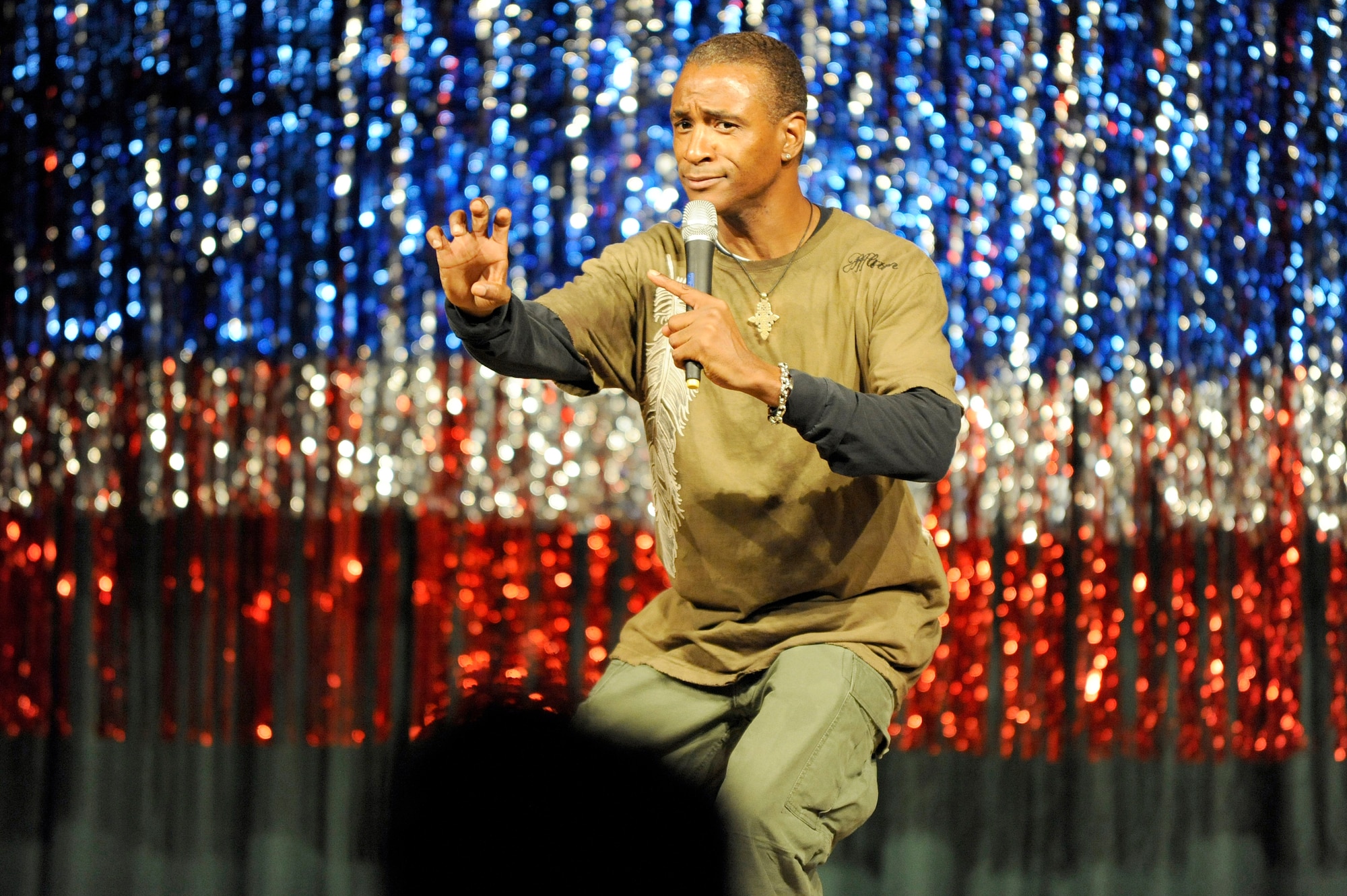 MISAWA AIR BASE, Japan -- Actor and comedian Tommy Davidson entertains the crowd with impressions and jokes at Misawa Club May 7. Davidson's specialty is impersonations of famous African American personalities, including Michael Jackson, M.C. Hammer, Spike Lee, Sugar Ray Leonard, and Stevie Wonder. (U.S. Air Force photo/Staff Sgt. Marie Brown/Released)