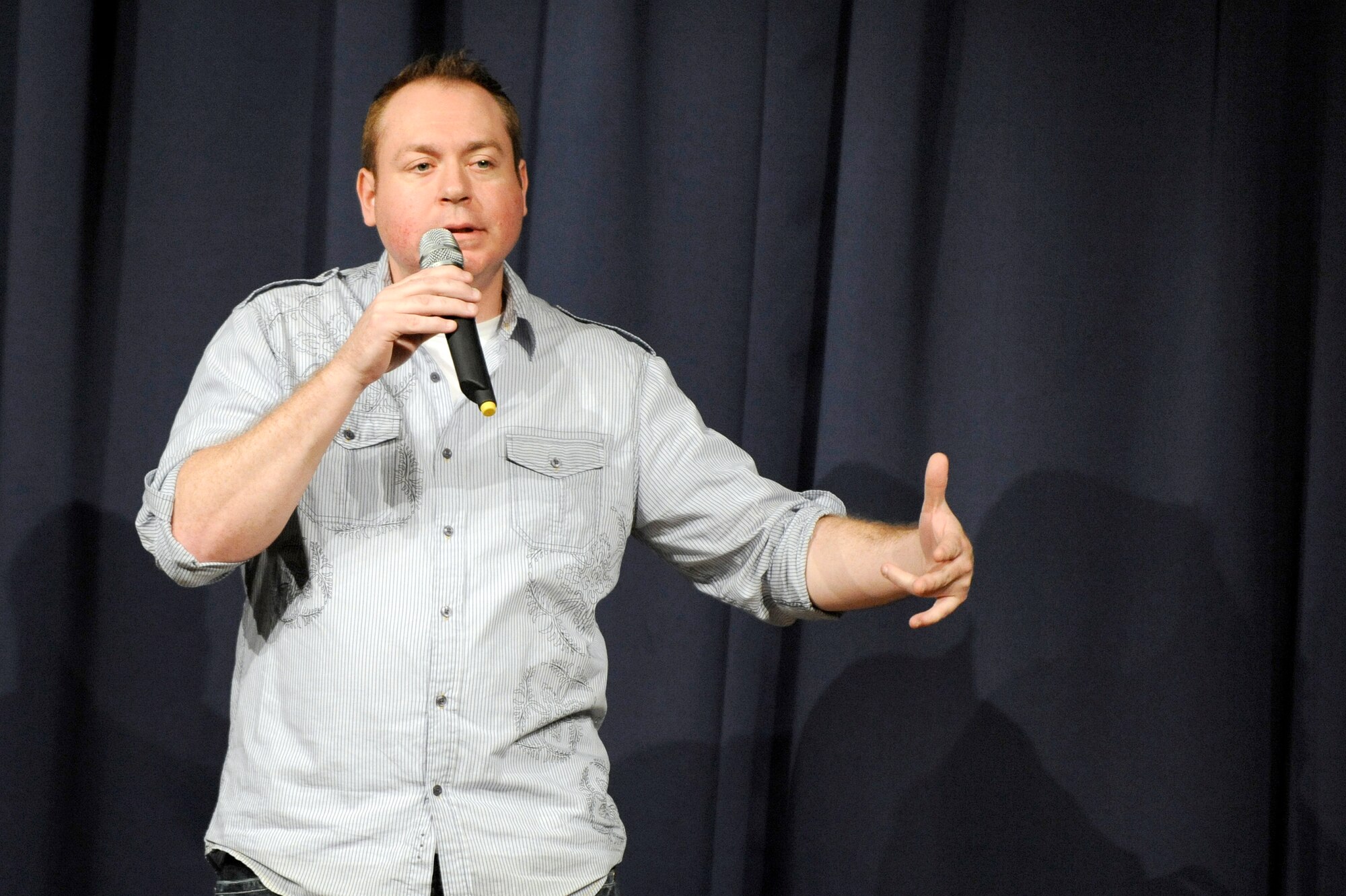 MISAWA AIR BASE, Japan -- Rob Maher performs during comedy night and the Misawa club May 7. Maher's quick style and delivery kept the crowd laughing throughout his set. Maher's performance at Misawa AB was part of an Armed Forces Entertainment tour in support of military members and their families. (U.S. Air Force photo/Staff Sgt. Marie Brown/Released)