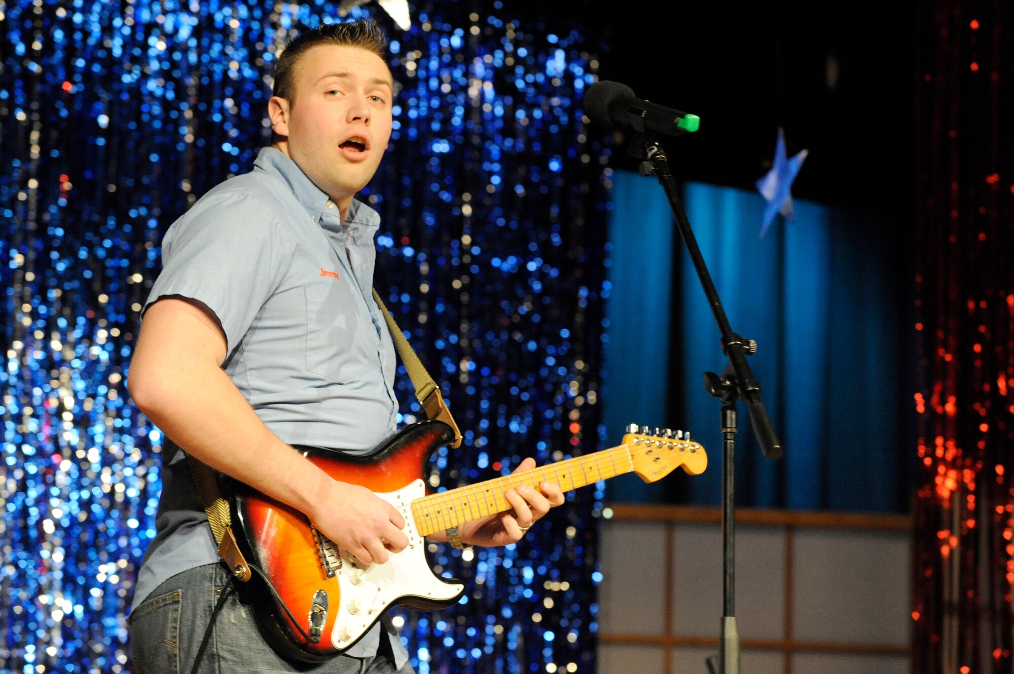 MISAWA AIR BASE, Japan -- Airman 1st Class Jimmy Moreland, Detachment 12 Armed Forces Network, performs for a packed house May 6. The 35th Force Support Squadron held the final round of Misawa Idol where seven contestants competed for the grand prize of $1,000. (U.S. Air Force photo/Staff Sgt. Marie Brown/Released)