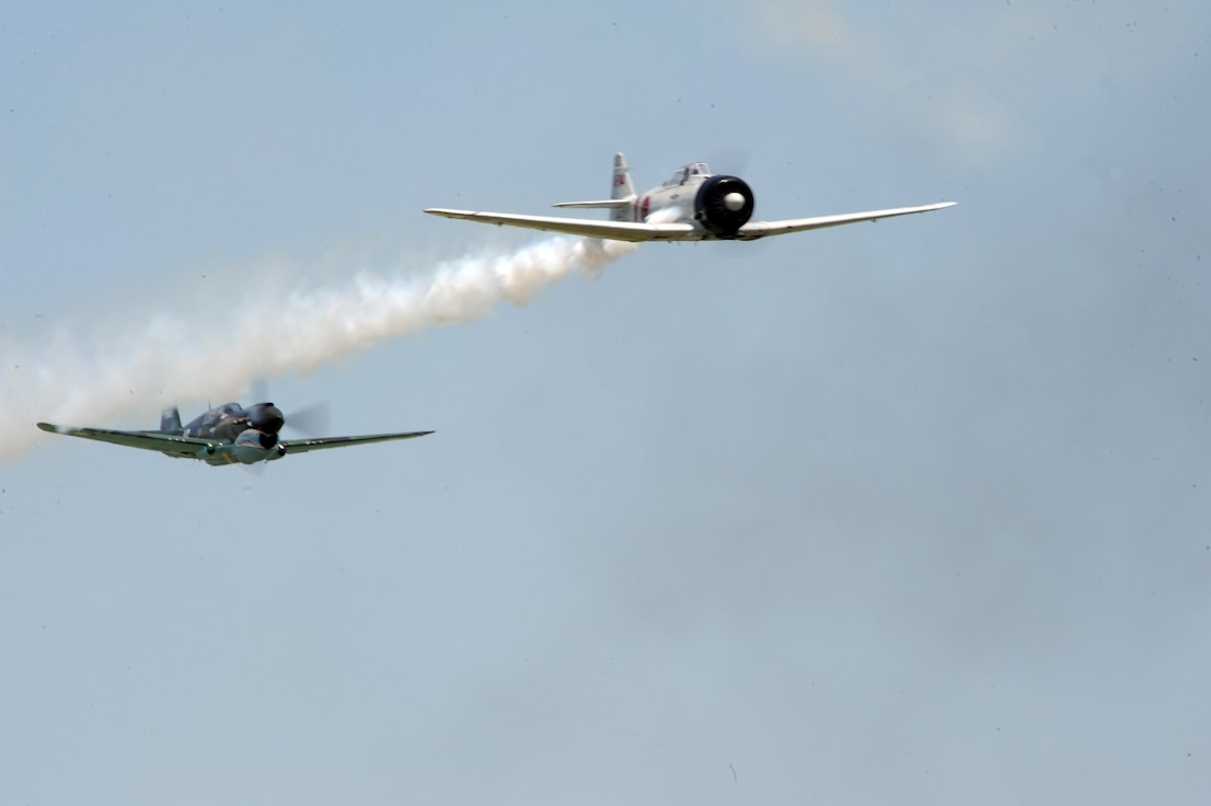 Tora! Tora! Tora! pilots fly over the crowd during the 2011 Defenders of Liberty Air Show on Barksdale Air Force Base, La., May 7. The team uses professional announcers, pyrotechnics, historic fighters and bombers to re-enact the Pearl Harbor attack. (U.S. Air Force photo/Airman 1st Class Micaiah Anthony)(RELEASED)