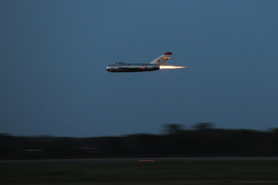 Randy Ball flies a MIG-17F during the Twilight Show on Barksdale Air Force Base, La., May 6. The Twilight Show was a special demonstration for military members and their families to enjoy prior to the Defenders of Liberty Air Show, which was open to the public May 7 and 8. (U.S. Air Force photo/Airman 1st Class Micaiah Anthony) (RELEASED)
