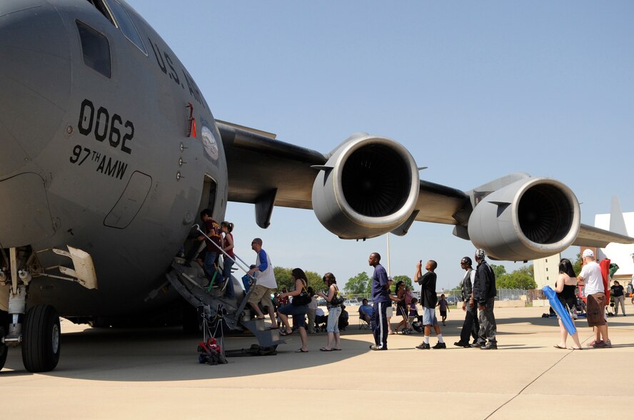 Spectators take pictures and line up for a tour of the inside of a C-17 from Altus Air Force Base, Okla., during the Defenders of Liberty Air Show at Barksdale Air Force Base, La., May 7. A tour of aircraft gives the spectators a close and personal view of what life is like in the United States Air Force. (U.S. Air Force photo/Staff Sgt. John Gordinier) (Released)