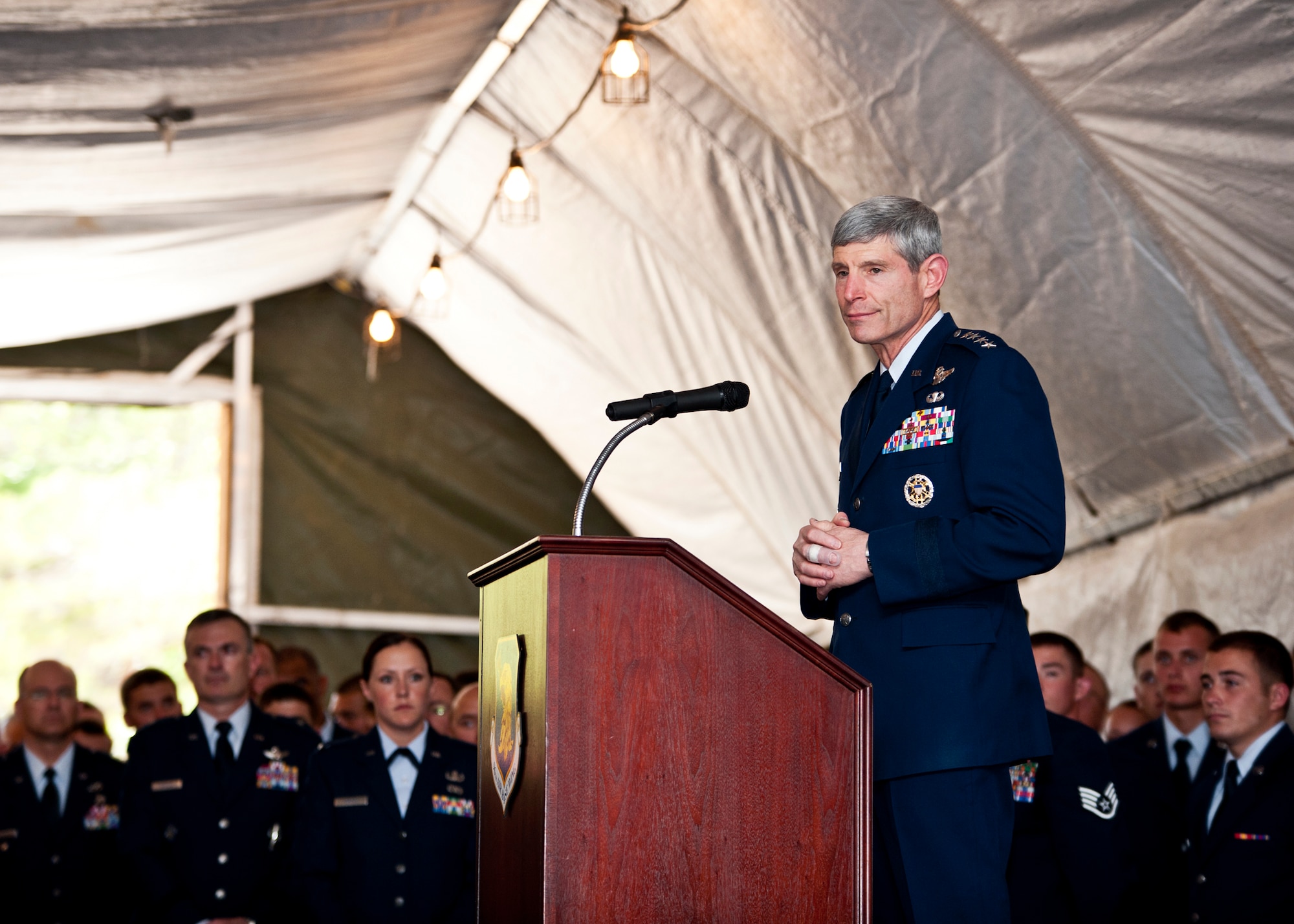 Air Force Chief of Staff Gen. Norton Schwartz pays tribute to the families of lost and injured explosive ordnance disposal Airmen May 7, 2011, at Eglin Air Force Base, Fla.  The general and Chief Master Sgt. of the Air Force James Roy addressed Air Force attendees and family members immediately after the annual EOD memorial ceremony, during which two new names of EOD Airmen were added to the wall. The general applauded Air Force EOD Airmen everywhere and sincerely thanked them for their sacrifices, both at home and overseas.  In his remarks, General Schwartz also commemorated those EOD Airmen who have paid the ultimate price in service to their country.  (U.S. Air Force photo/Samuel King Jr.)