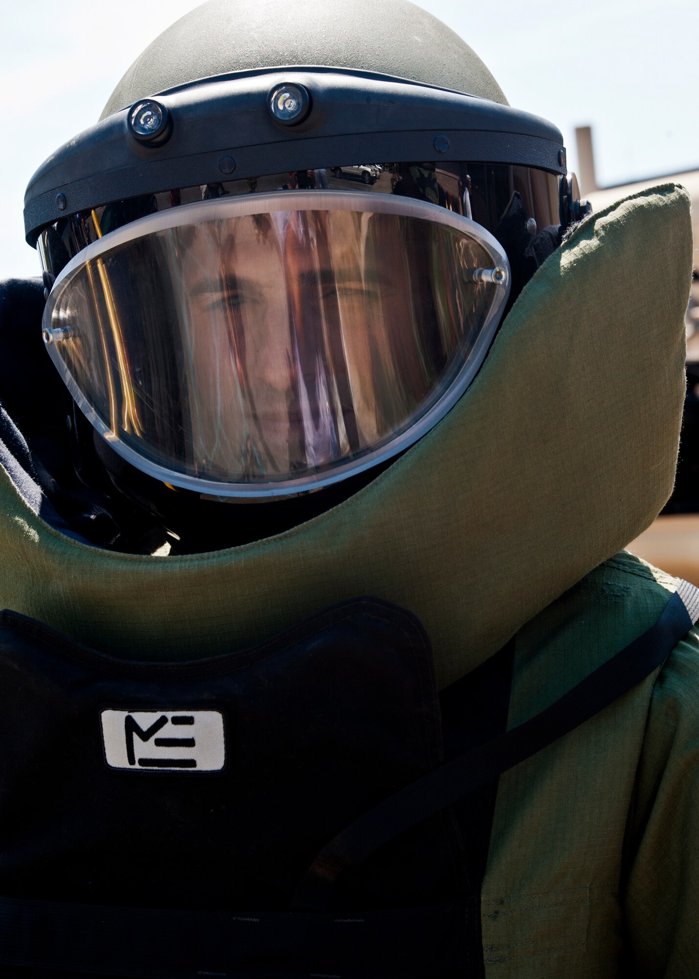 Navy Lt. Matt Malone, division officer at the Naval Explosive Ordnance Disposal School, dons the bomb suit during a demonstration at the school house May 7.  Demonstrations and displays were available to the visitors  who'd attended the EOD Memorial ceremony that day.  Fifteen new names were added to the memorial wall this year.  The total, which includes all services, now stands at 269.  (U.S. Air Force photo/Samuel King Jr.)