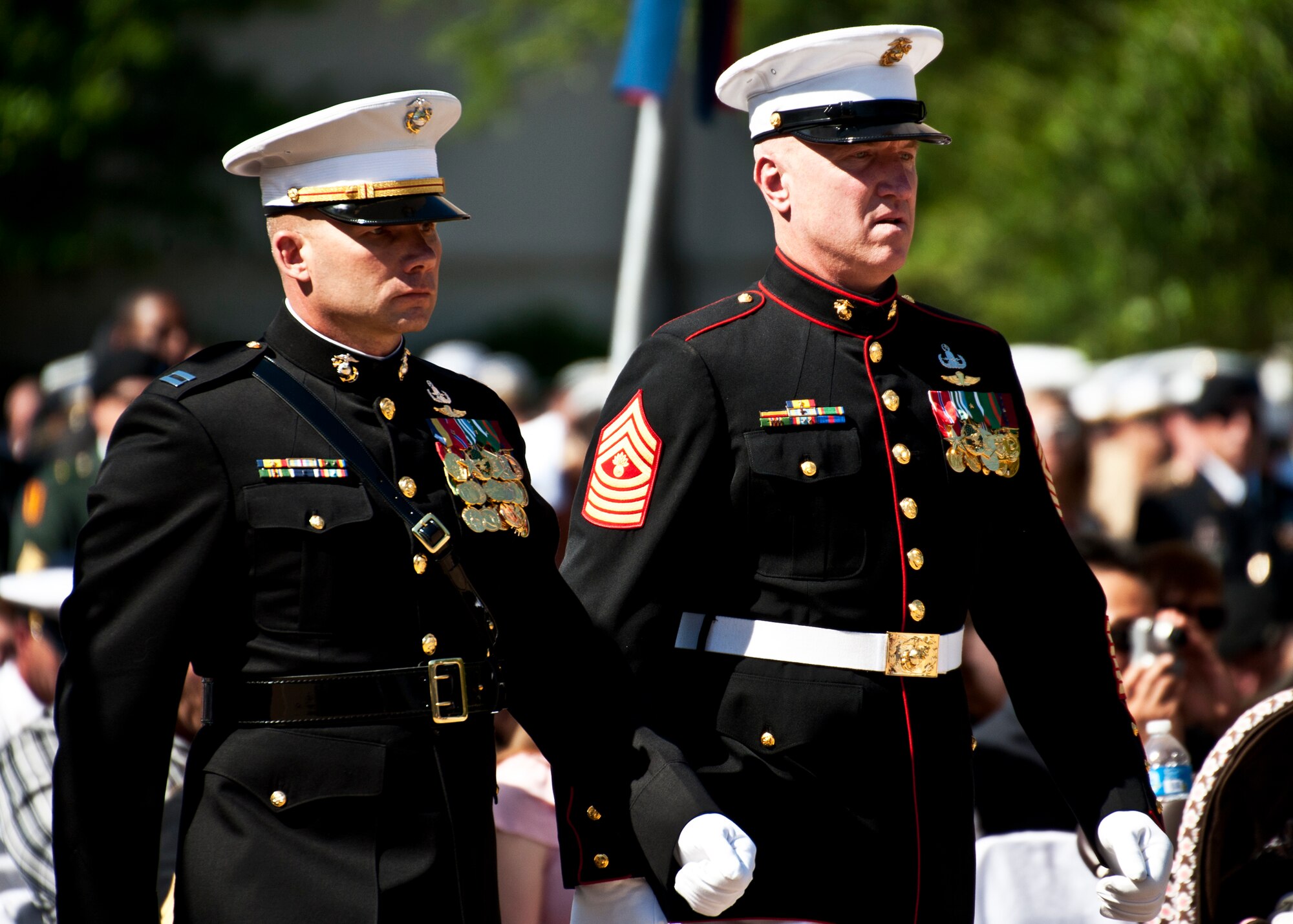 Capt. Schmidt and Gunnery Sgt. Carroll move toward the Explosive Ordnance Disposal memorial to lay a wreath in front of the Marine Corps wall during the ceremony May 7 at Eglin Air Force Base, Fla.  Fifteen new names were added to the memorial wall this year.  The total, which includes all services, now stands at 269.  The Marine Corps added eight names to the wall – Staff Sgt.s Adam Perkins, Joshua Cullins, Jordan Emrick, Gunnery Sgt.s Christopher Eastman, Floyd Holley, Justin Schmalstieg, Master Sgt. Daniel Fedder and Sgt. Jason Smith. (U.S. Air Force photo/Samuel King Jr.)