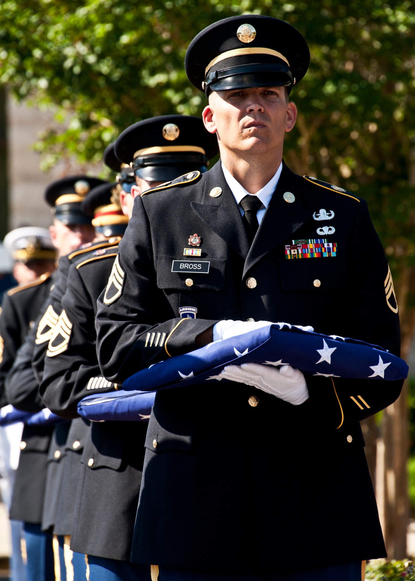 U.S. Army Soldiers hold American flags to be presented to the families of fallen Army explosive ordnance disposal technicians during this year’s EOD Memorial ceremony May 7 at Eglin Air Force Base, Fla.  Fifteen new names were added to the memorial wall this year.  The total, which includes all services, now stands at 269.  The Army added five names -  Specialist Wade Slack, Staff Sgt.s Shane Barnard, Derek Farley, Matthew West and Capt. Jason McMahon.   (U.S. Air Force photo/Samuel King Jr.)