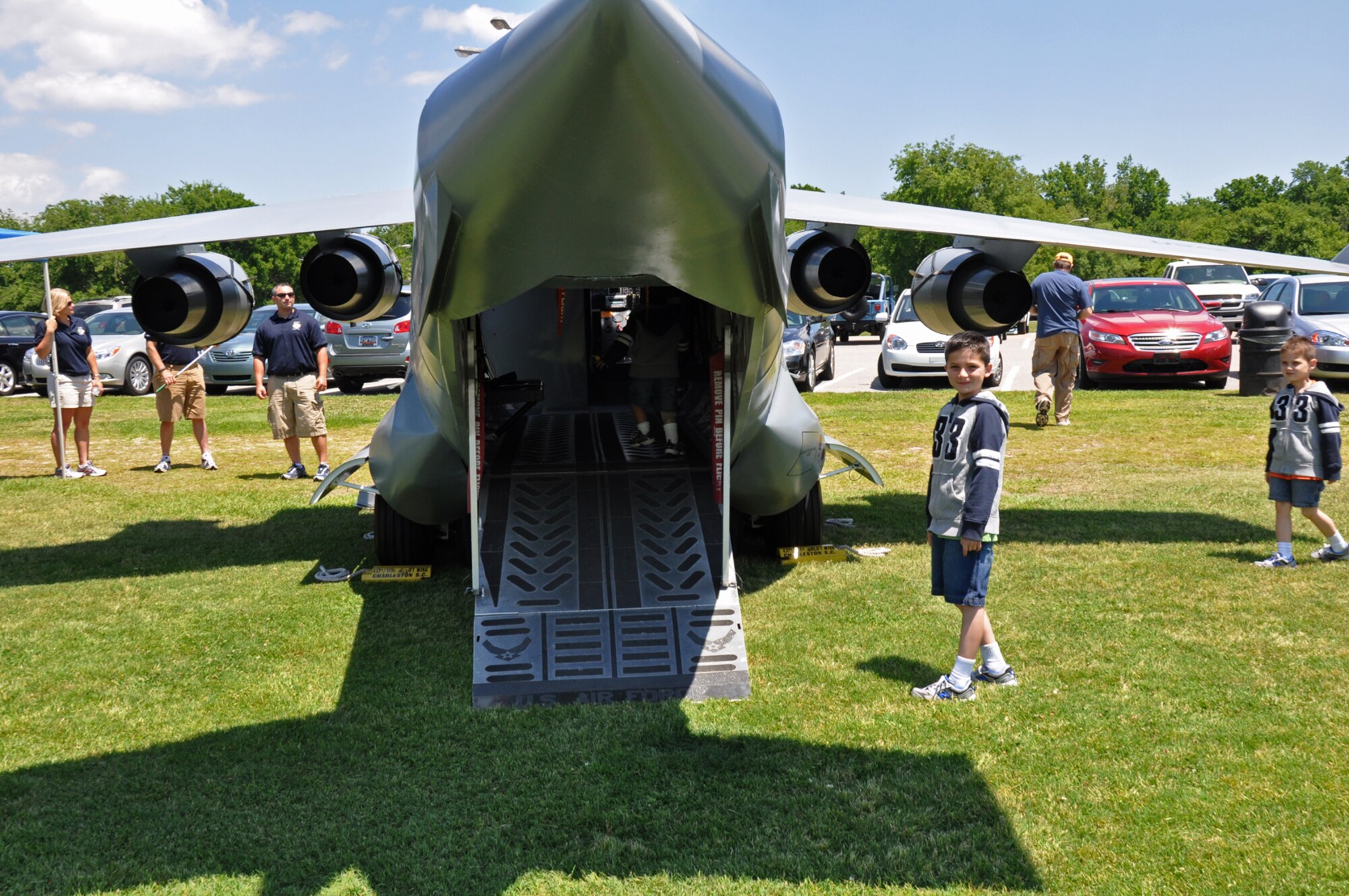 Shortly after it was set up, children started to gravitate toward the 31th Airlift Wing's mini C-17 on display at the Charleston VA Welcome Home event May 5, 2011. (U.S. Air Force photo by 1st Lt. Joe Simms)